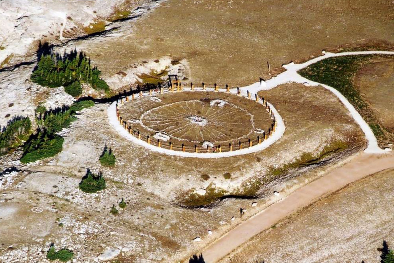 The Medicine Wheel and Medicine Mountain National Historic Landmark in 2011. The rock circle is about 80 feet in diameter, with 28 '"spokes" radiating from a central cairn, five cairns around the rim and a sixth slightly outside the perimeter.