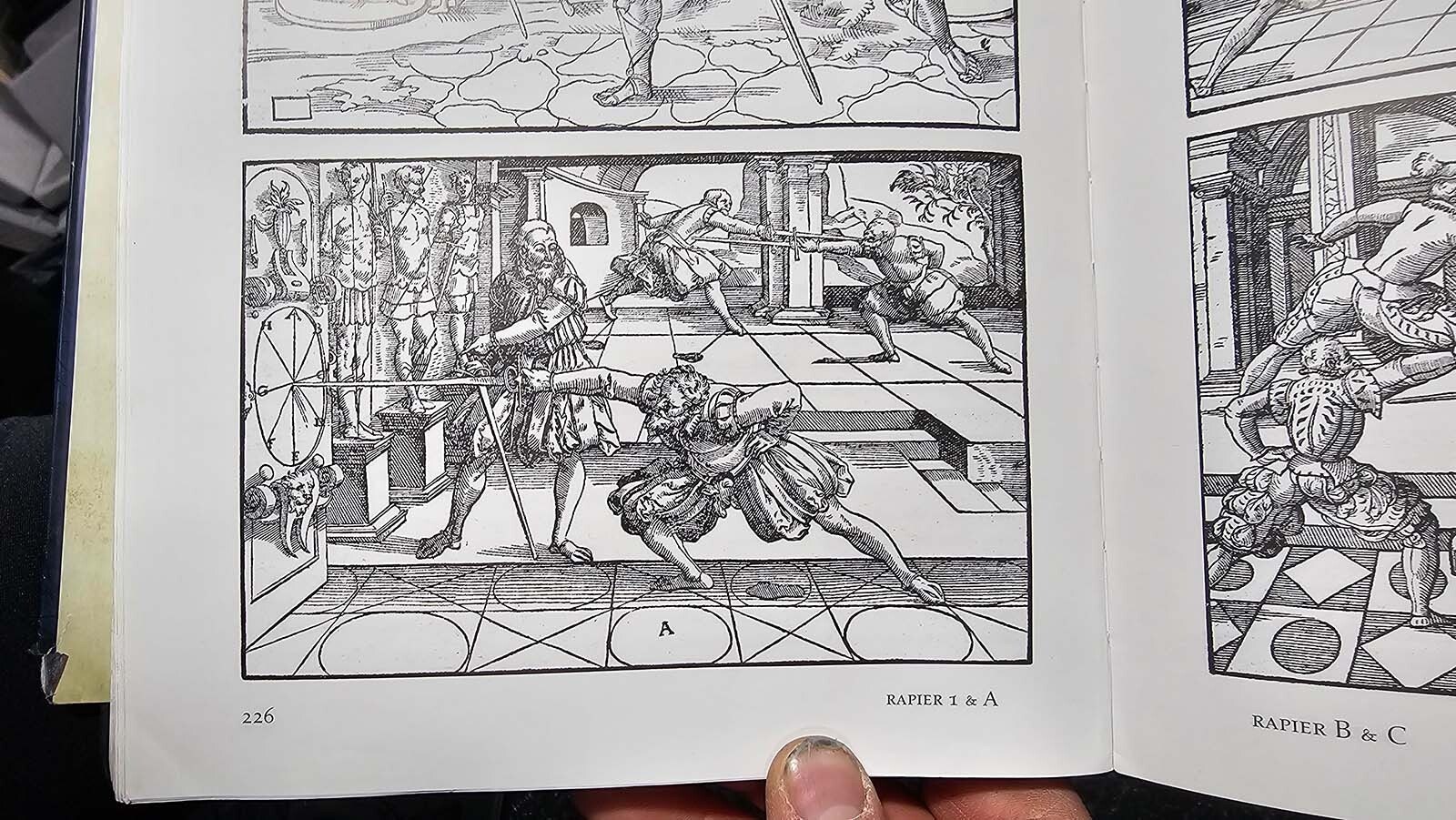 Some of the wood block printed illustrations in a copy of the book, "Art of Combat." The book was put together by German Joachim Meyer and printed in the year 1570. Meyer went bankrupt printing the book and died of plague not long after. It is a beautiful book, however, and popular, ranging the man some measure of immortality. Copies of the book today can go for several hundred dollars.