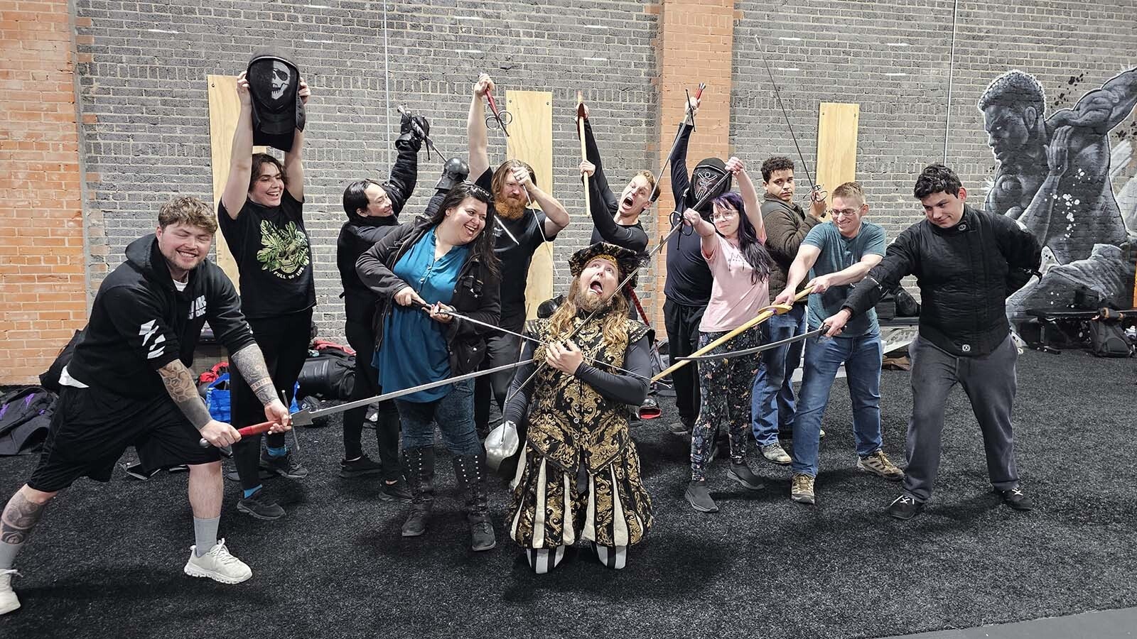 The Historical European Martial Arts class in Cheyenne demonstrates both humor and technique in a mock-killing of their instructor, Michael Binsse.