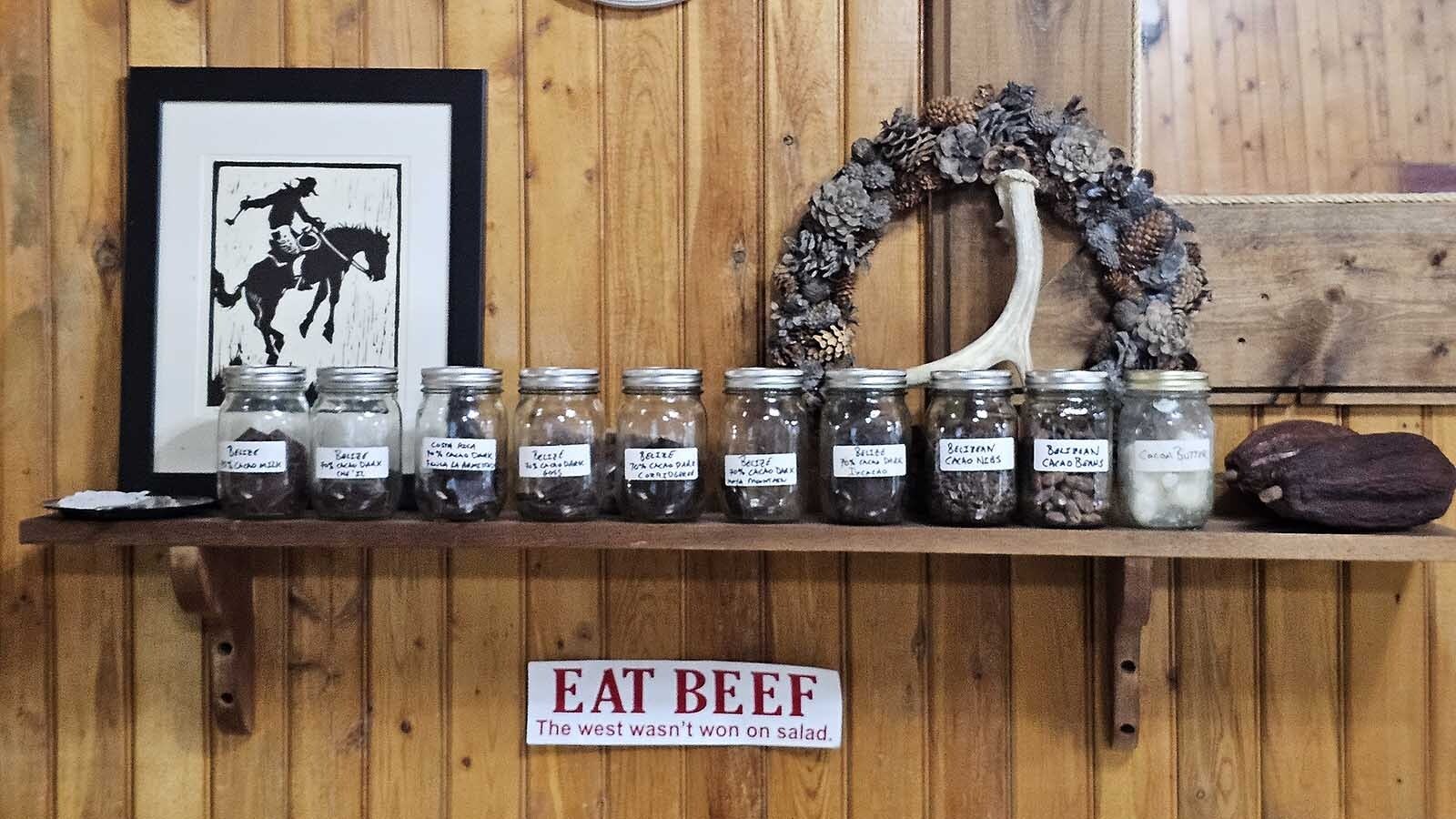 Samples of cacao beans and a cacao pod on a shelf at Meeteetse Chocolatier.