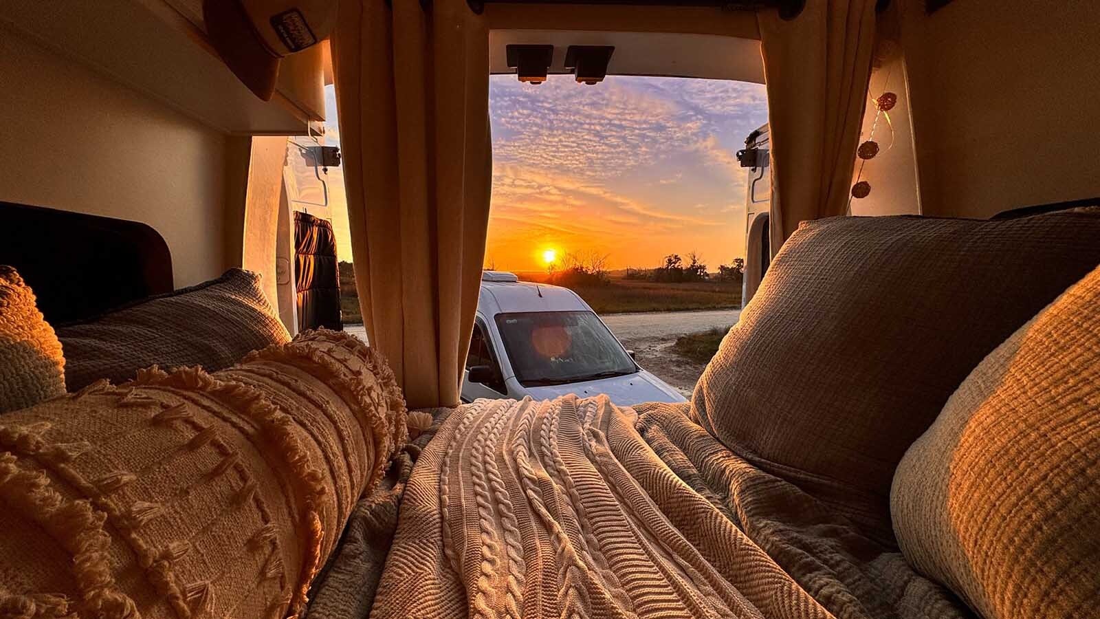 Cody, Wyoming, native Megan Anderson is up before sunrise every day, researching the financial markets for her job as vice president of client relations for a real estate firm. Her office is a Ford Transit van she’s lived in for the better part of a year, along with her traveling companion, Snoop.