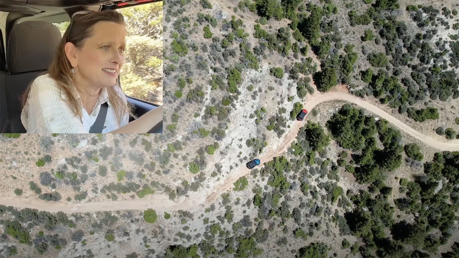 Melissa Cook drives while a drone gets video from above.