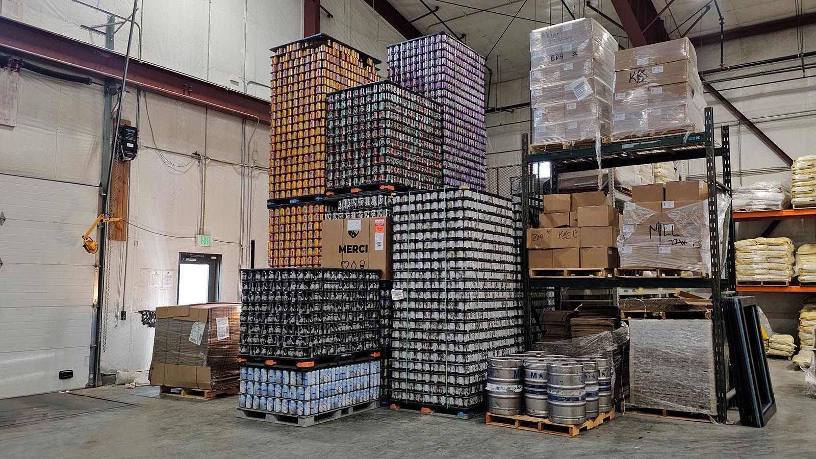 Towering stacks of cans await their destiny — getting filled with liquid gold beer.