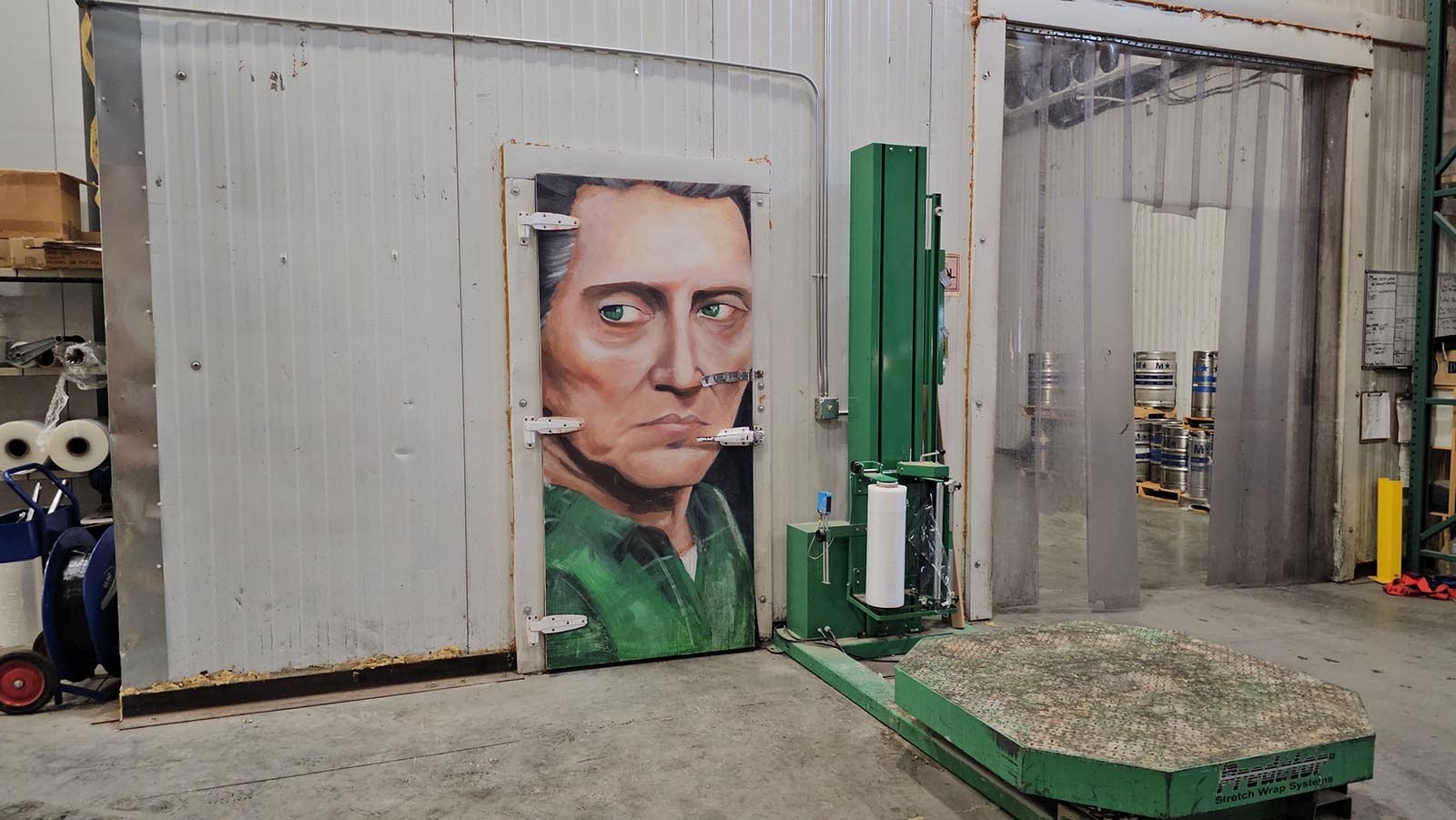 A portrait of Christopher Walken covers the door of the walk-in cooler.