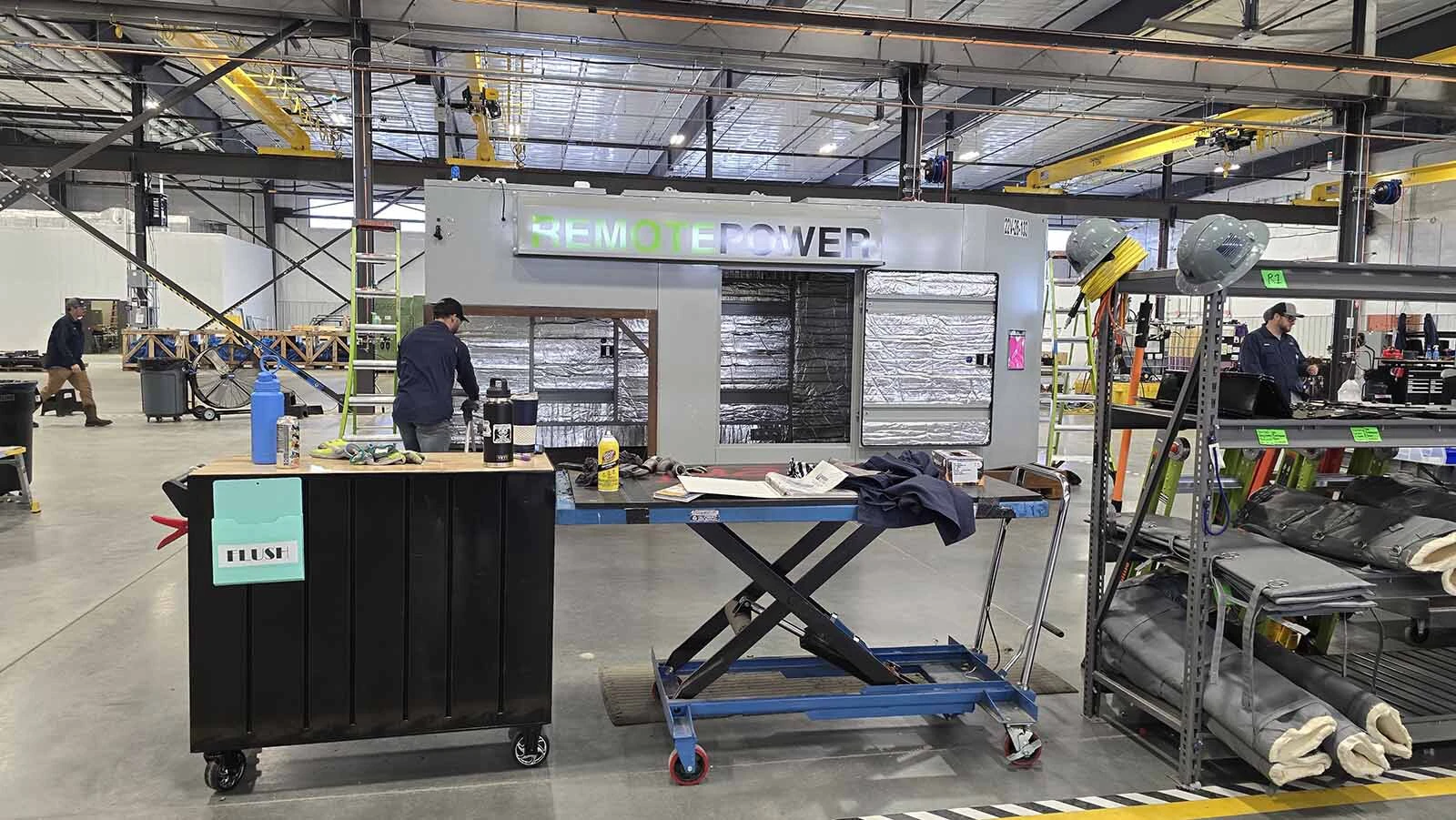 An employee works on a Mesa Power Solutions assembly line at its new $70 million plant in Evansville in Natrona County.