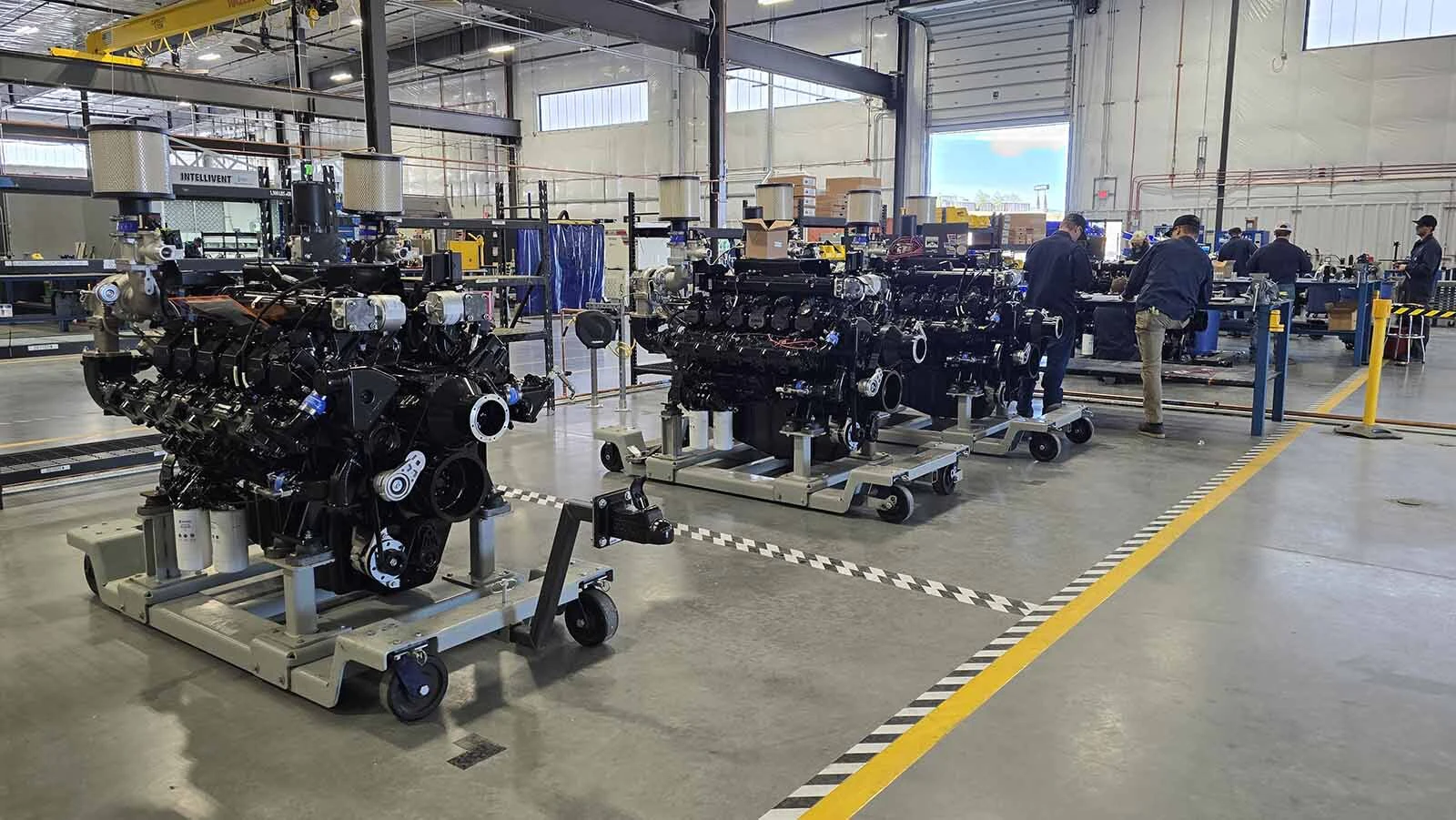 Engines are being assembled at this station, and will be moved into place as the engine further down the line is moved onto the assembly line.