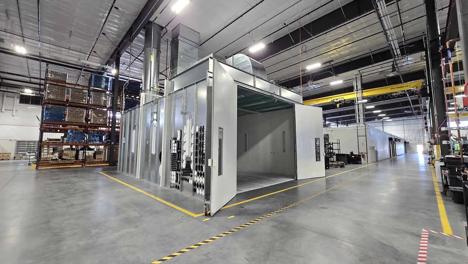 This paint booth is part of the refurbishment shop. Old engines are taken from power generators, taken apart and put back together, and repainted.
