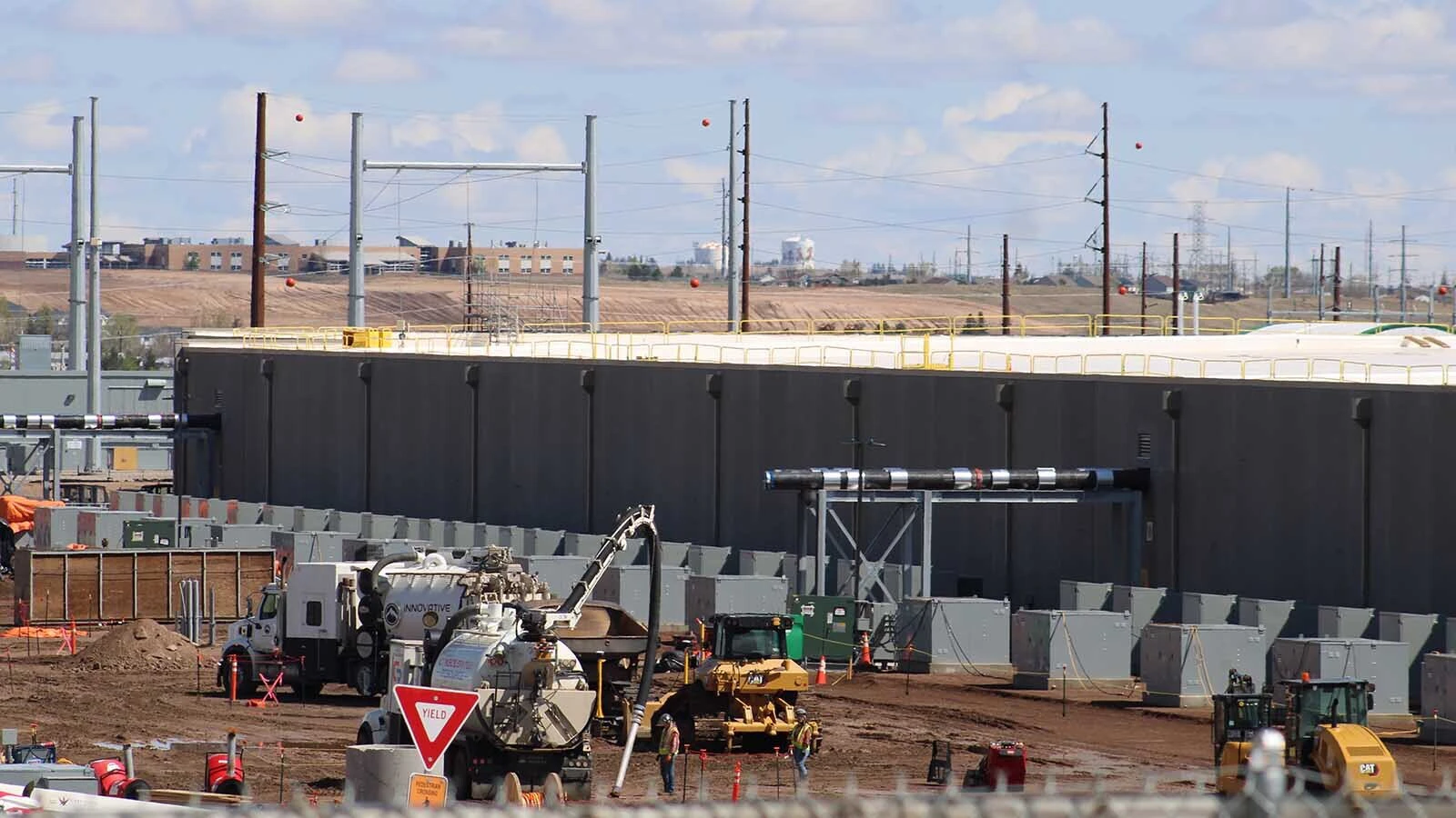 A 5,600-worker man camp south of Cheyenne would be larger than 83 Wyoming incorporated places and be “almost like a little city,” the mayor says. “How do you plan to keep our community safe?” asks one resident, while officials say more housing is needed. Above, work is underway at a Meta data center in south Cheyenne not far from where a proposed man camp could be located.