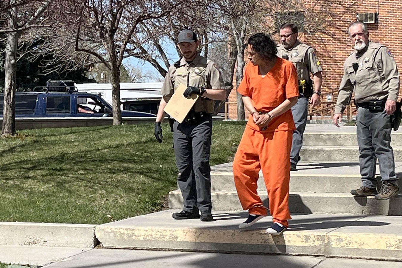 Deputies escort a shackled Michael Vigil to a jail transport vehicle after Vigil’s initial appearance in Lander Circuit Court on Tuesday afternoon.