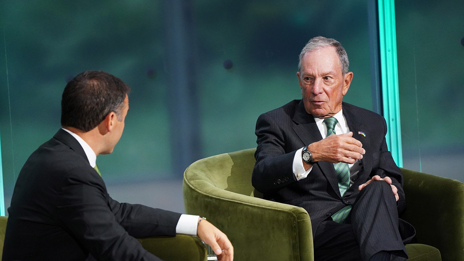 Billionaire Michael Bloomberg, right, speaks at Thursday's New York Times Climate Summit. He's pledged another $500 million to bring an end to coal- and gas-fired power generation in the United States.