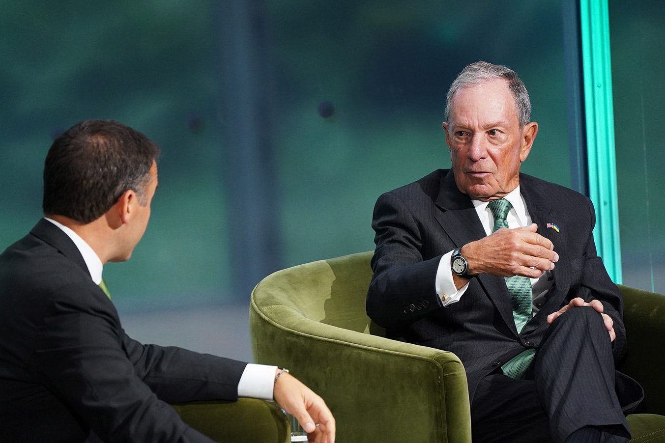 Billionaire Michael Bloomberg, right, speaks at Thursday's New York Times Climate Summit. He's pledged another $500 million to bring an end to coal- and gas-fired power generation in the United States.