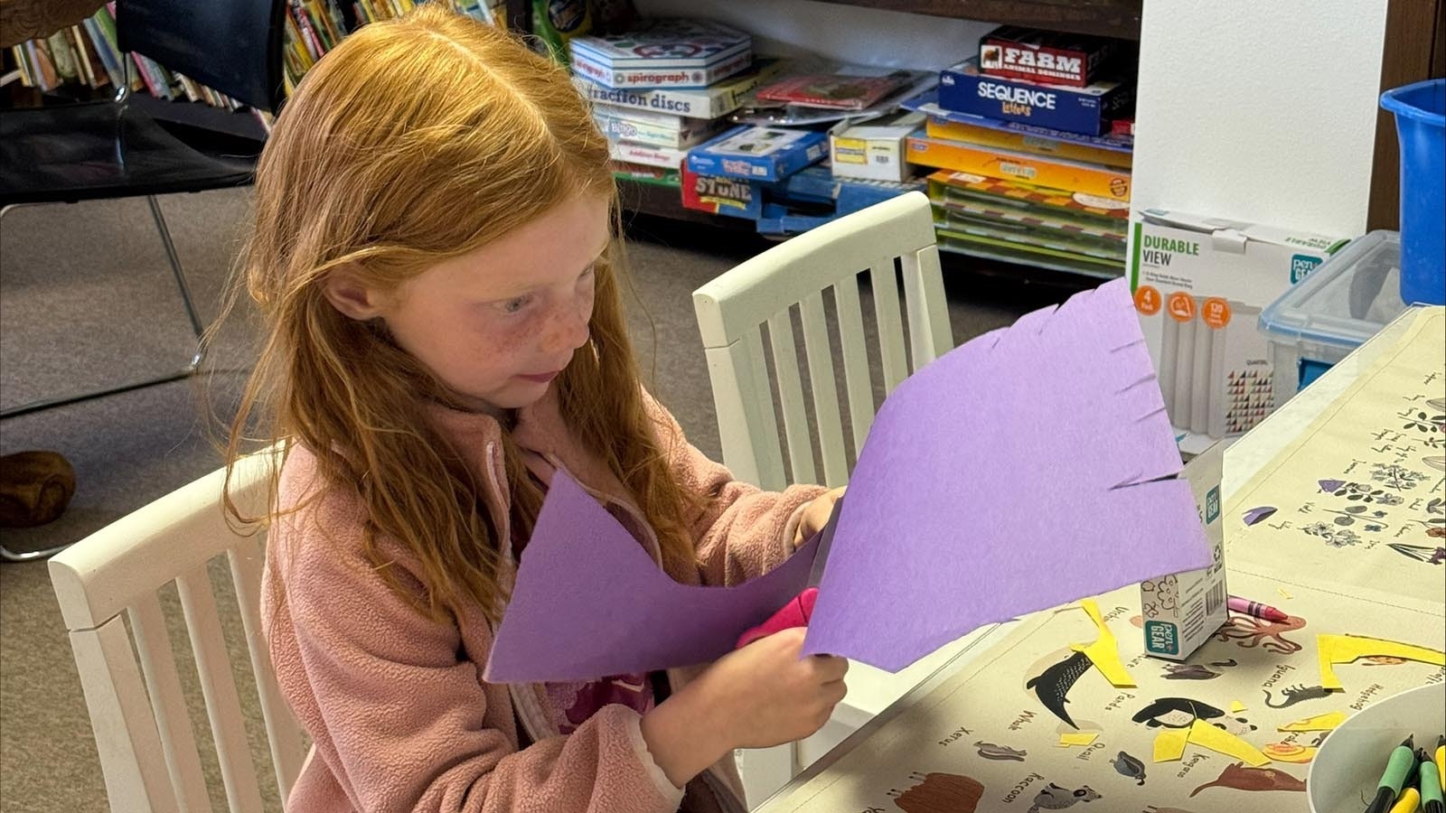 Juliana Brady, 6, does an art project in the new one-room school.