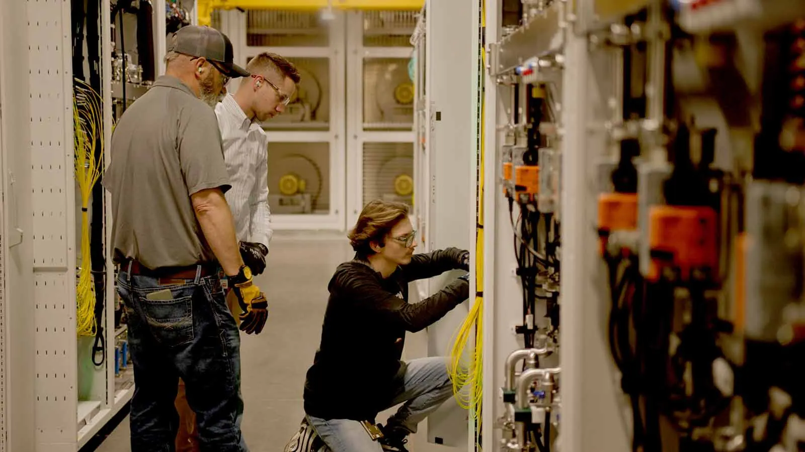 As Wyoming watches up to 70% of its young adults leave the state by age 30, a Cheyenne native’s path at Microsoft shows how data center jobs could help reverse the state’s biggest export — it’s own people. Here, Wyomingites work in a Microsoft data center.