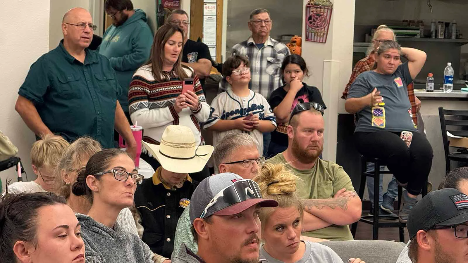 More than 100 people packed into the Midwest Recreation Center on Wednesday to begin a full-court press to save grades 6-12 of their school from the chopping block.