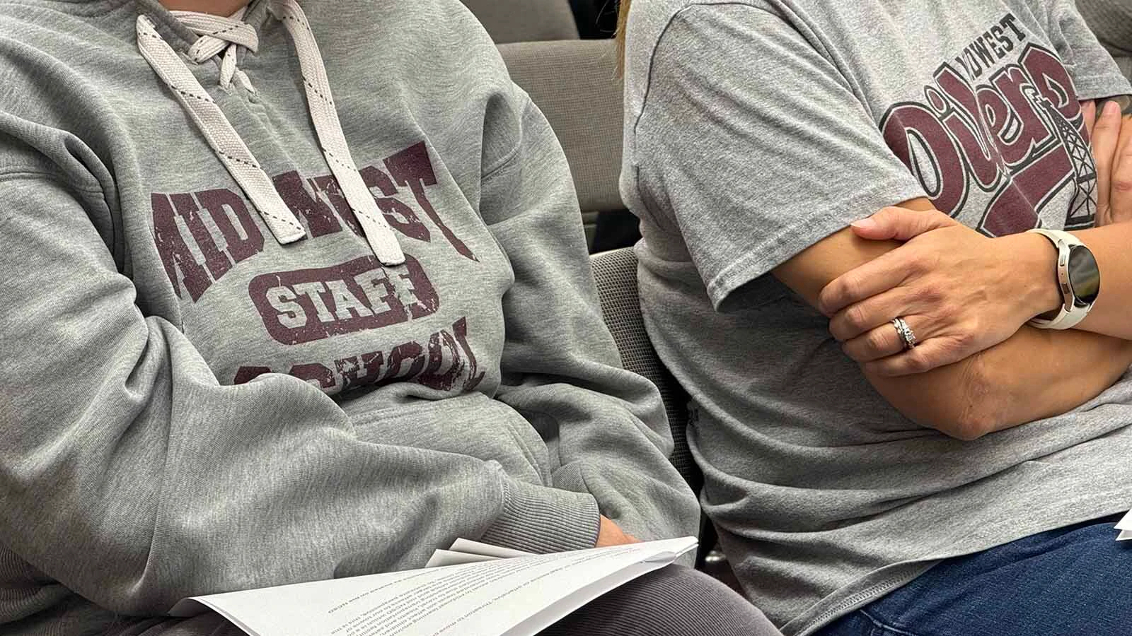 More than 100 people packed into the Midwest Recreation Center on Wednesday to begin a full-court press to save grades 6-12 of their school from the chopping block.