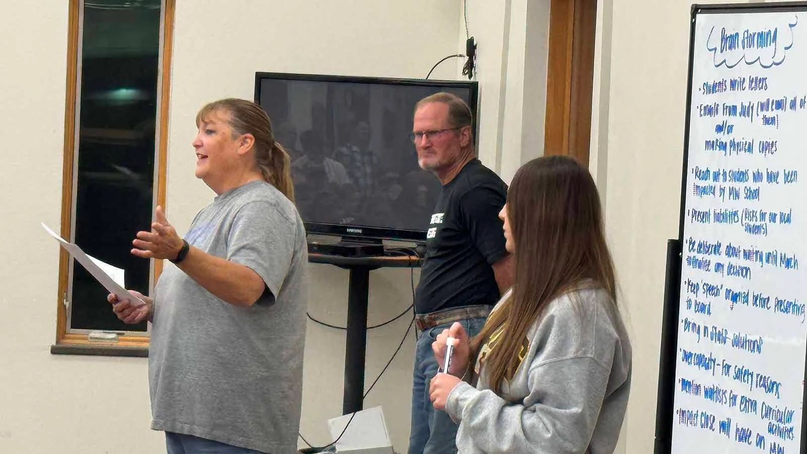 Darla Lindsay, from left, Brain Balfour and Logan Fleminger during Wednesday's Midwest town hall meeting.