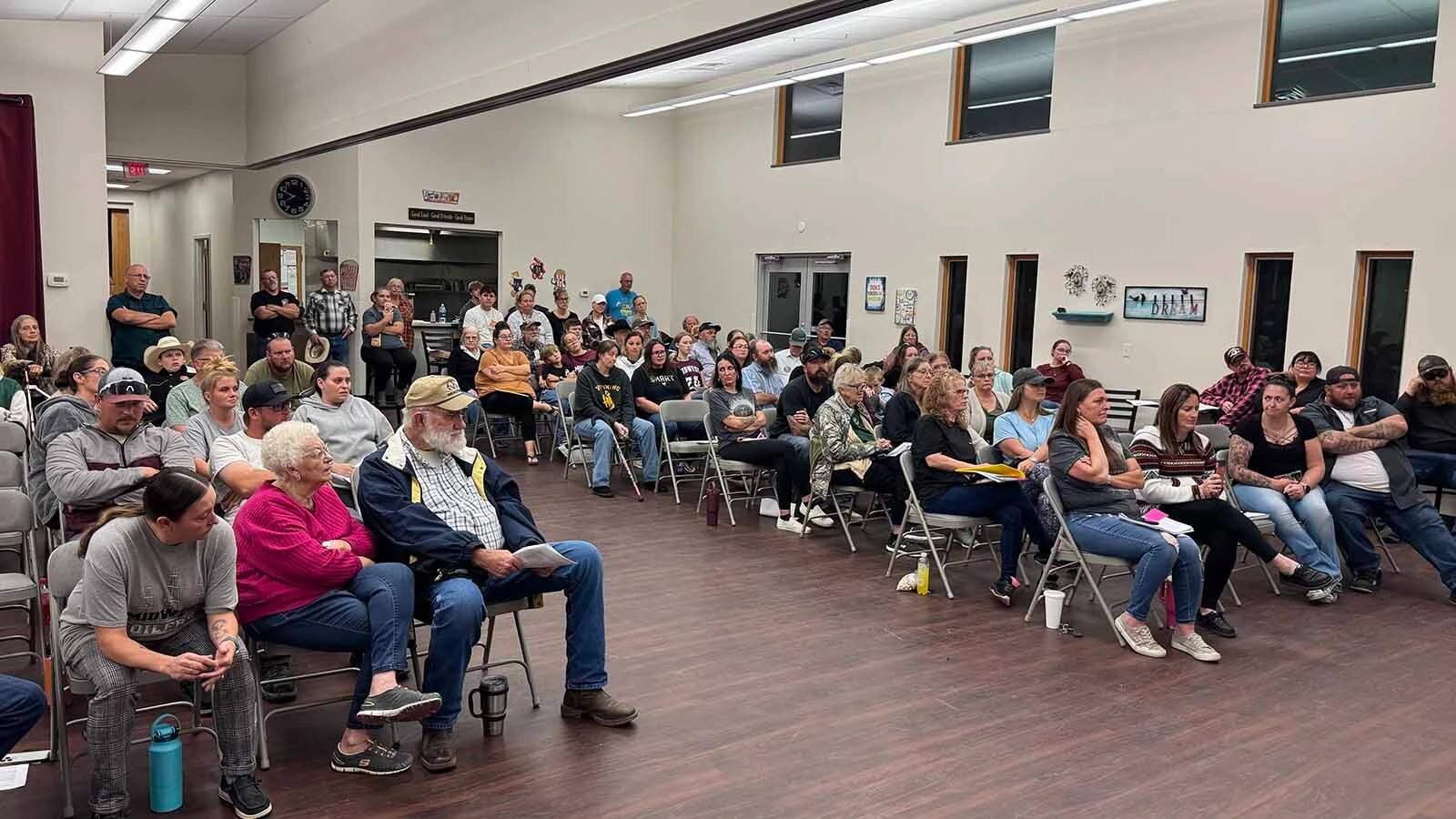 More than 100 people packed into the Midwest Recreation Center on Wednesday to begin a full-court press to save grades 6-12 of their school from the chopping block.