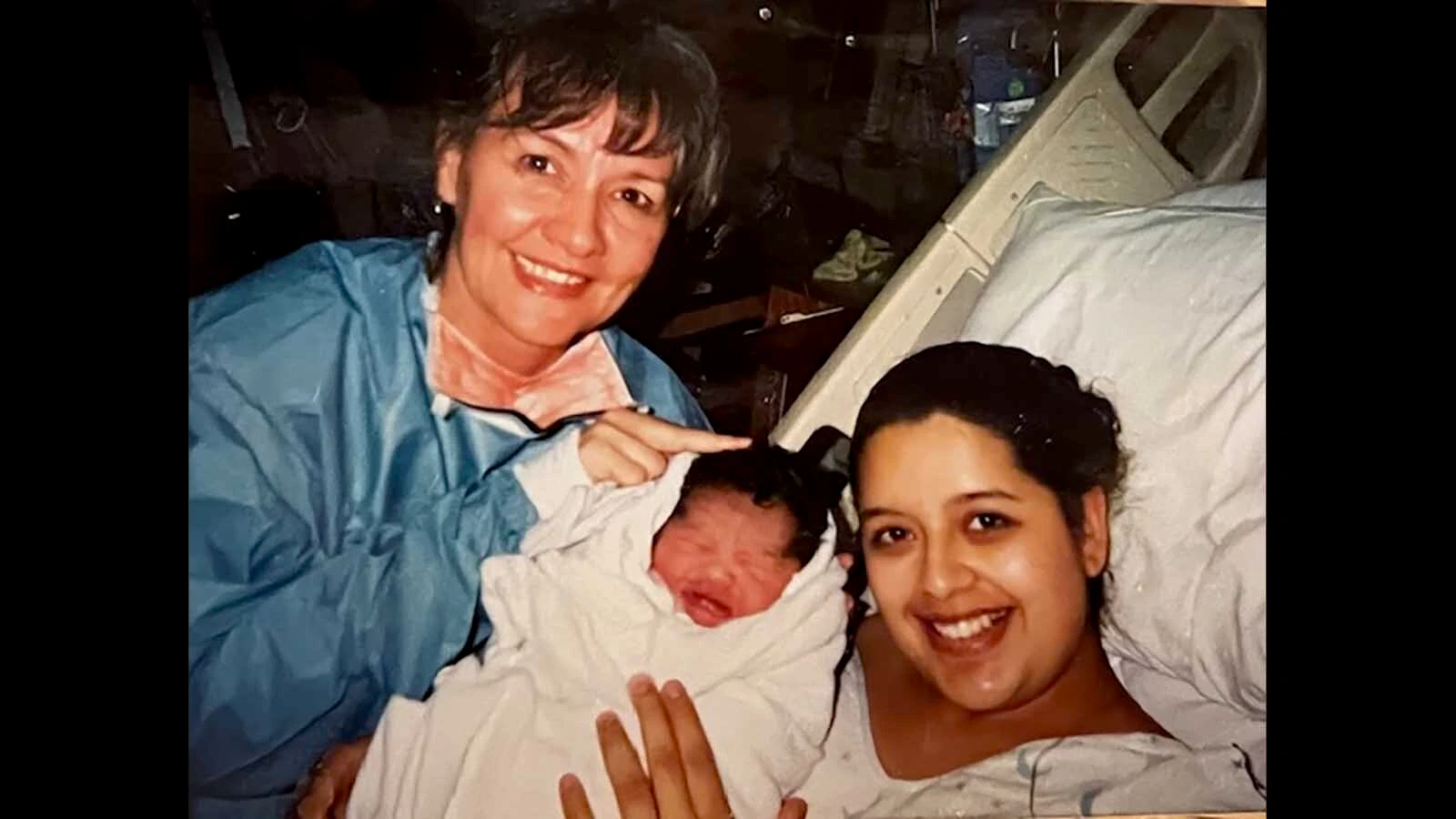 Happy mom and baby pose with Helen La Rose for a photo just after birth.