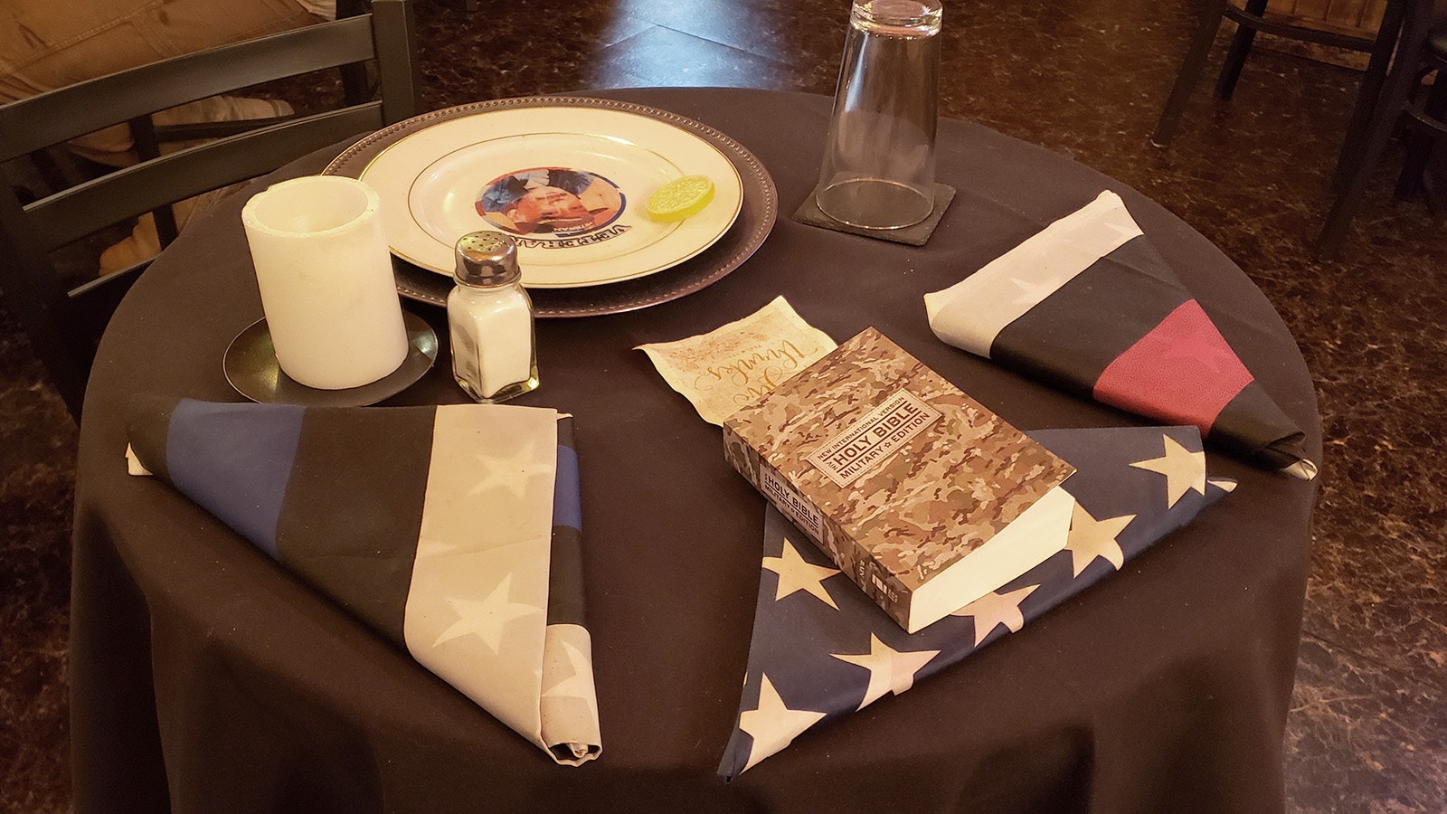 A "missing man" table is set in recognition of military service and sacrifice above and beyond the call of duty.