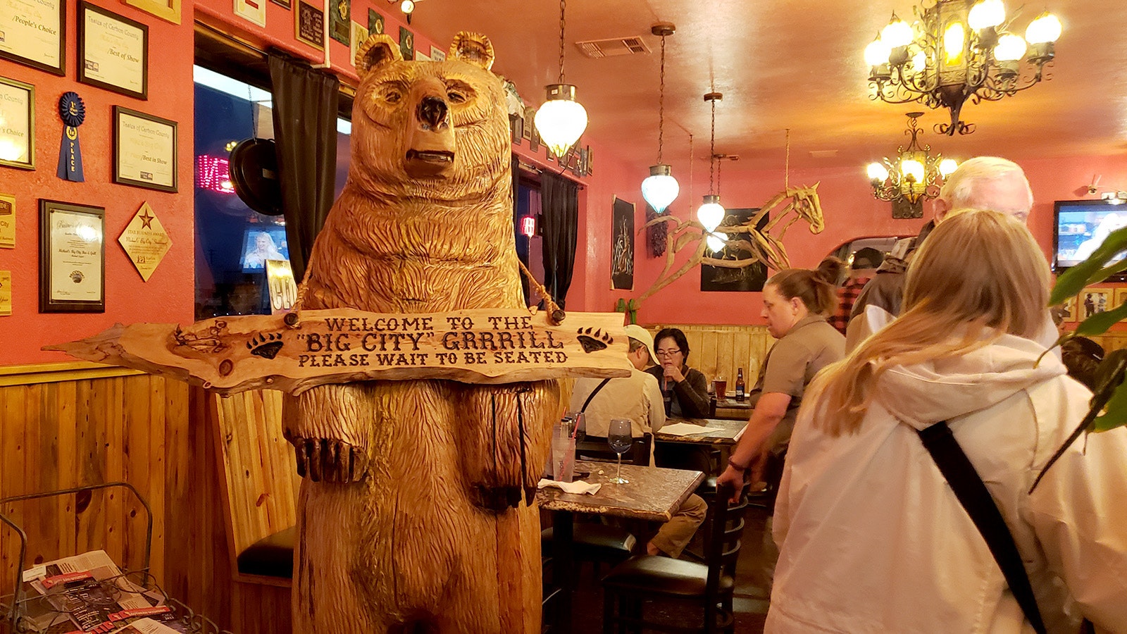 A huge wooden bear welcomes guests to Michael's Big City Steakhouse in Rawlins.