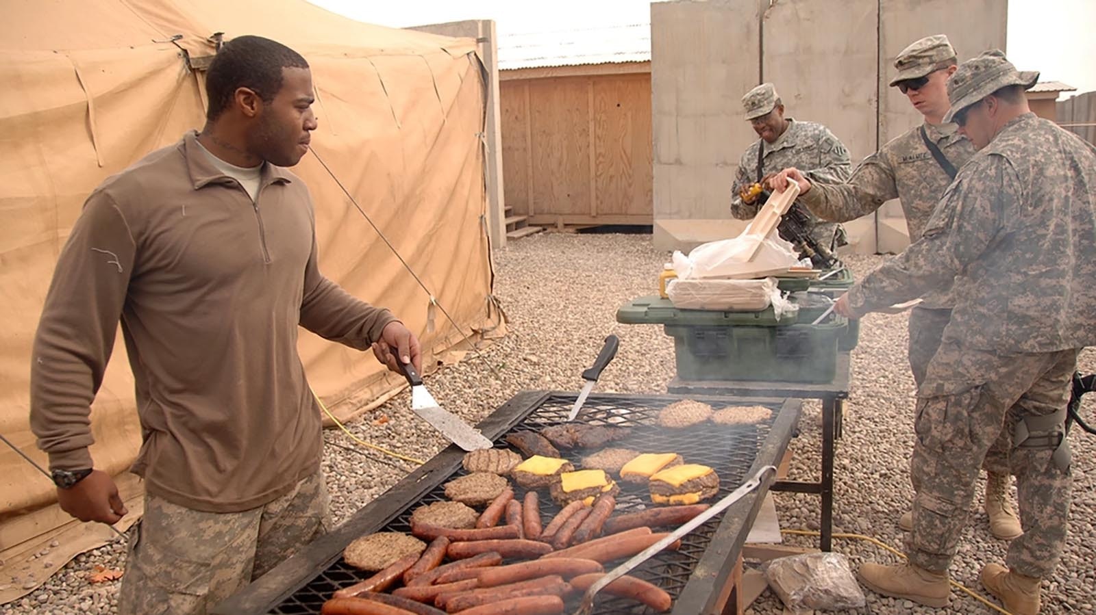 U.S. Soldiers, assigned to 1st Battalion, 64th Armored Regiment, 2nd Brigade Combat Team, 3rd Infantry Division, grab a hot meal on Joint Security Station Ash Shura, near Mosul, Iraq, in this file photo.