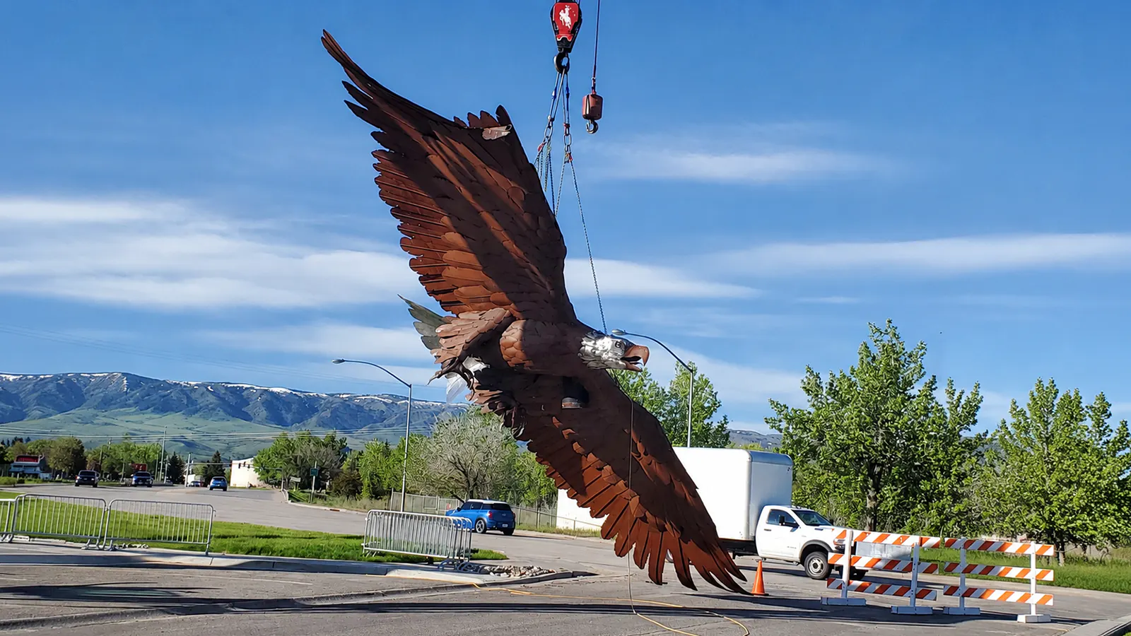 For a brief moment, the huge 8,100-pound Mills eagle really did fly. A crane carries the massive sculpture after wind damage forced the city to take it down for repairs. It was rewelded, reinforced and eventually reinstalled about 10 feet lower.