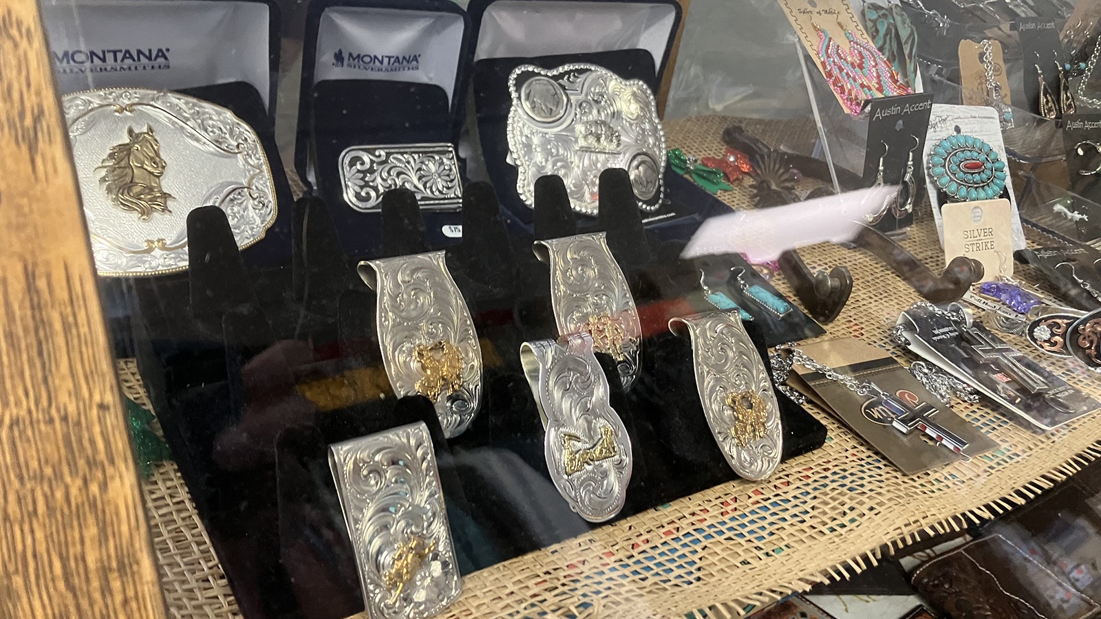 The buckles for sale at Moss Saddles Boots & Tack are generally bypassed by real cowboys who win their buckles at the rodeos.