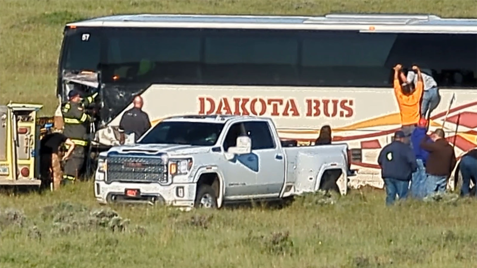 Passengers on a mine transport bus exit through a window after a head-on crash on Highway 59 on Sunday morning.