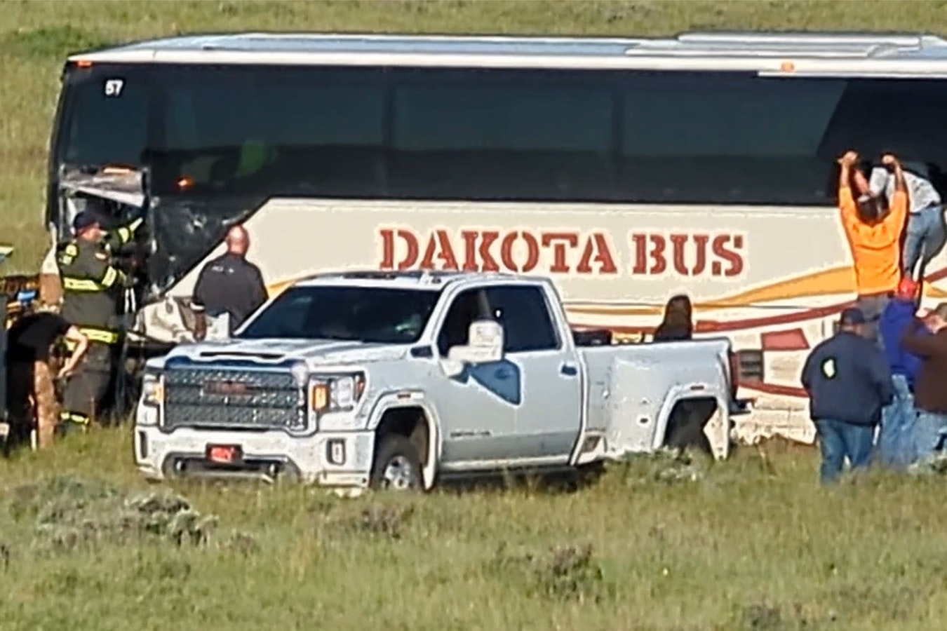 Passengers on a mine transport bus exit through a window after a head-on crash on Highway 59 on Sunday morning.