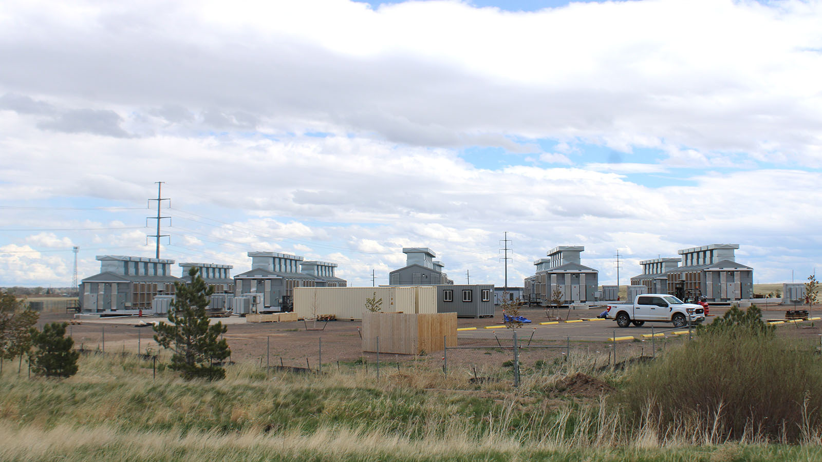 The MineOne Chinese bitcoin operation banned last week and ordered by President Joe Biden to shut down and sell off already is staging to clear out with large turcks and storage pods staged at the site, which is about a mile from F.E. Warren Air Force Base.