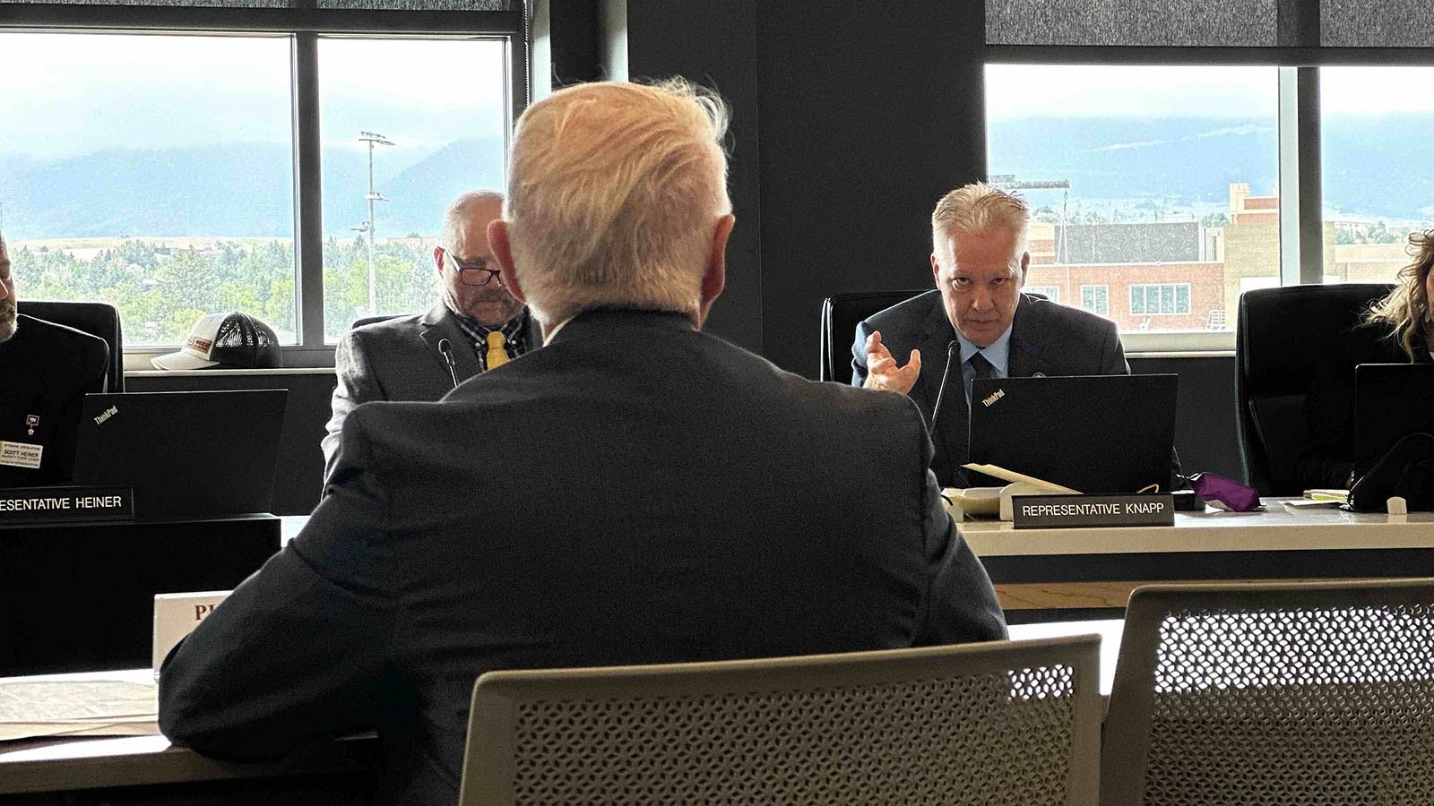 Randall Luthi, foreground, policy director for Gov. Mark Gordon, defends the state’s carbon capture requirements as he’s questioned by Rep. Christopher Knapp, R-Gillette, who voted unsuccessfully to repeal them.