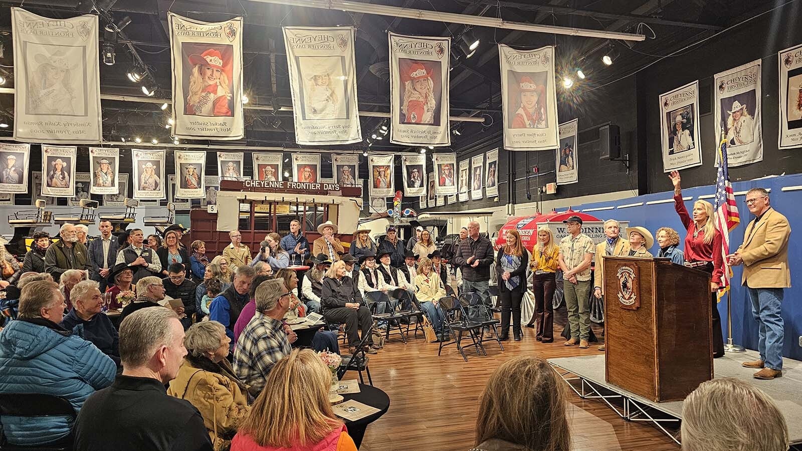 A crowd gathered in the Old West Museum in Frontier Park for a ceremony to unveil Miss Frontier.