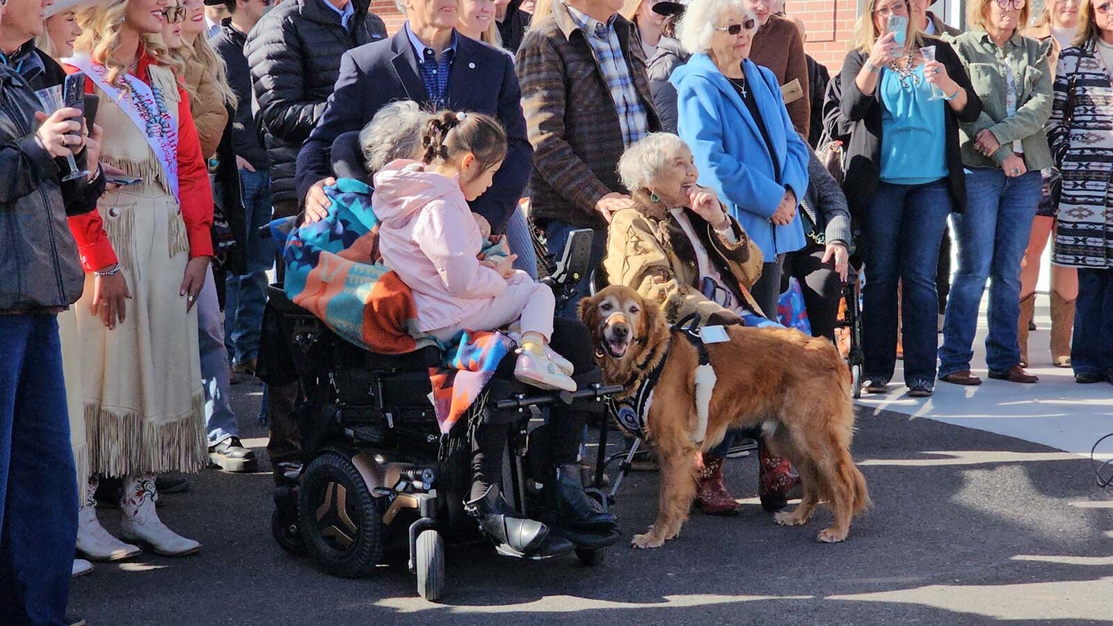 Janet Tyrrell Daly, seated on the right, smiles as she awaits the unveiling of Miss Frontier. Daly is the oldest living Miss Frontier, serving in the role in 1958.