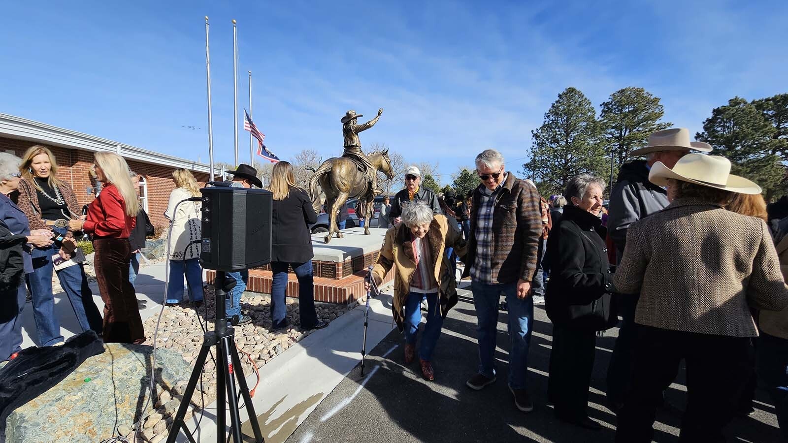 Jeanette Tyrrell Daly, center left, smiles as she returns from looking at Miss Frontier up close. Daly is the oldest living Miss Frontier, serving in the role in 1958.