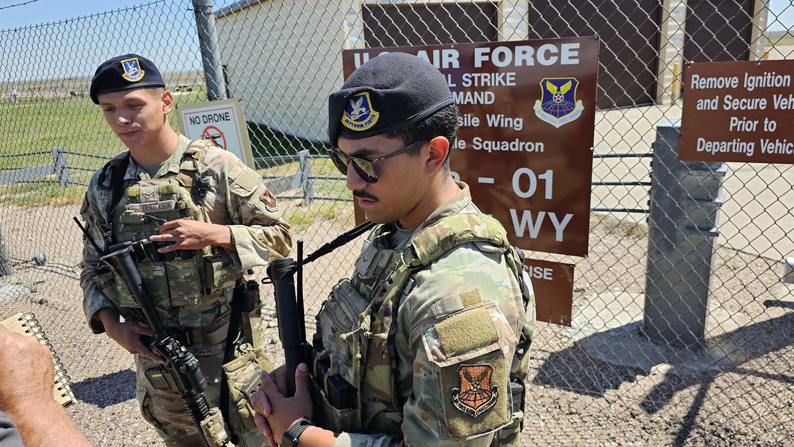 Airmen all "kitted up" with Kevlar armor and rifles. This is what they would wear if there was an alarm, regardless of whether caused by a stray animal or a human.