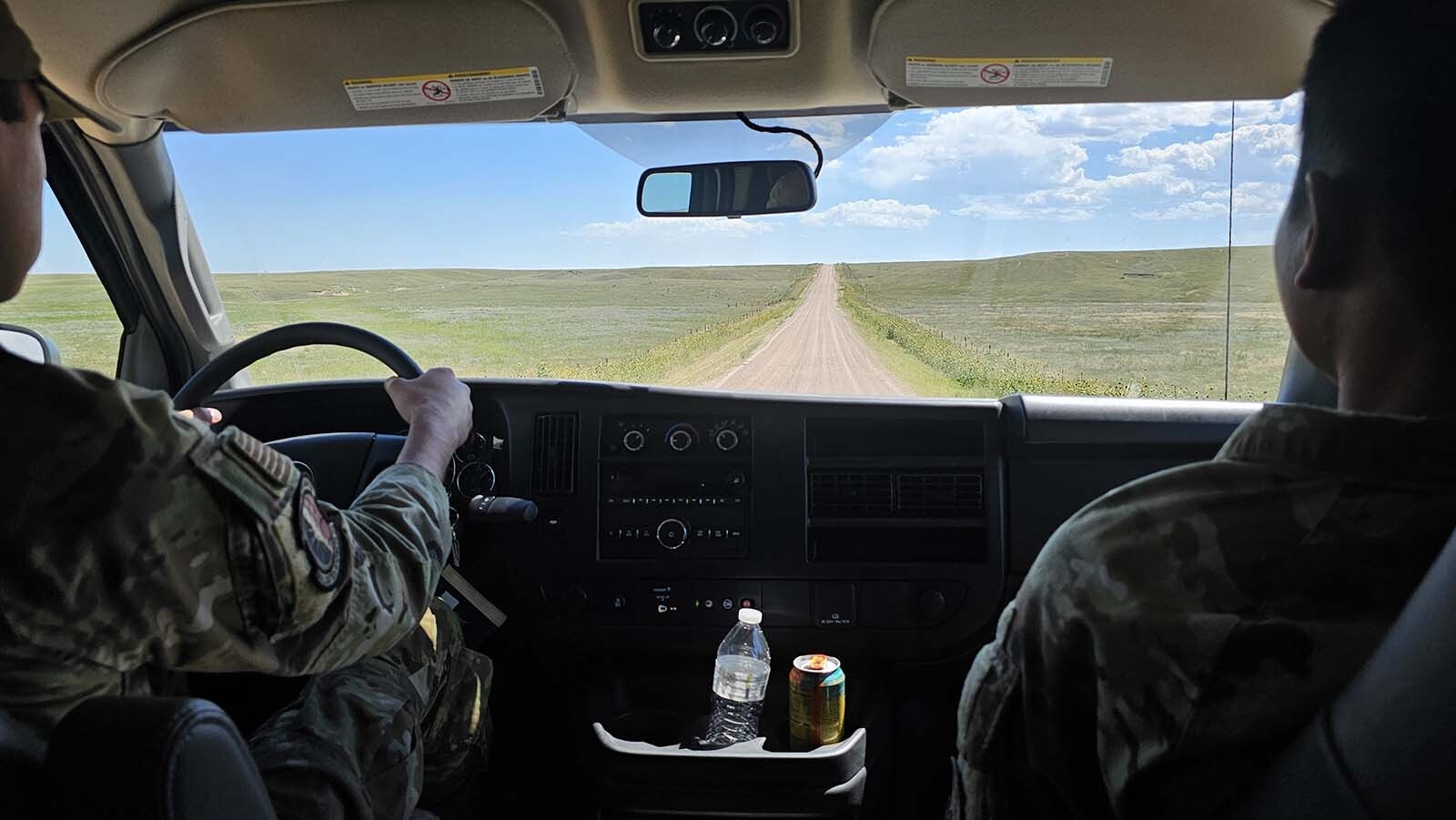 The road to the Alpha 01 Military Alert Facility is a narrow ribbon of dirt and gravel between agricultural land.