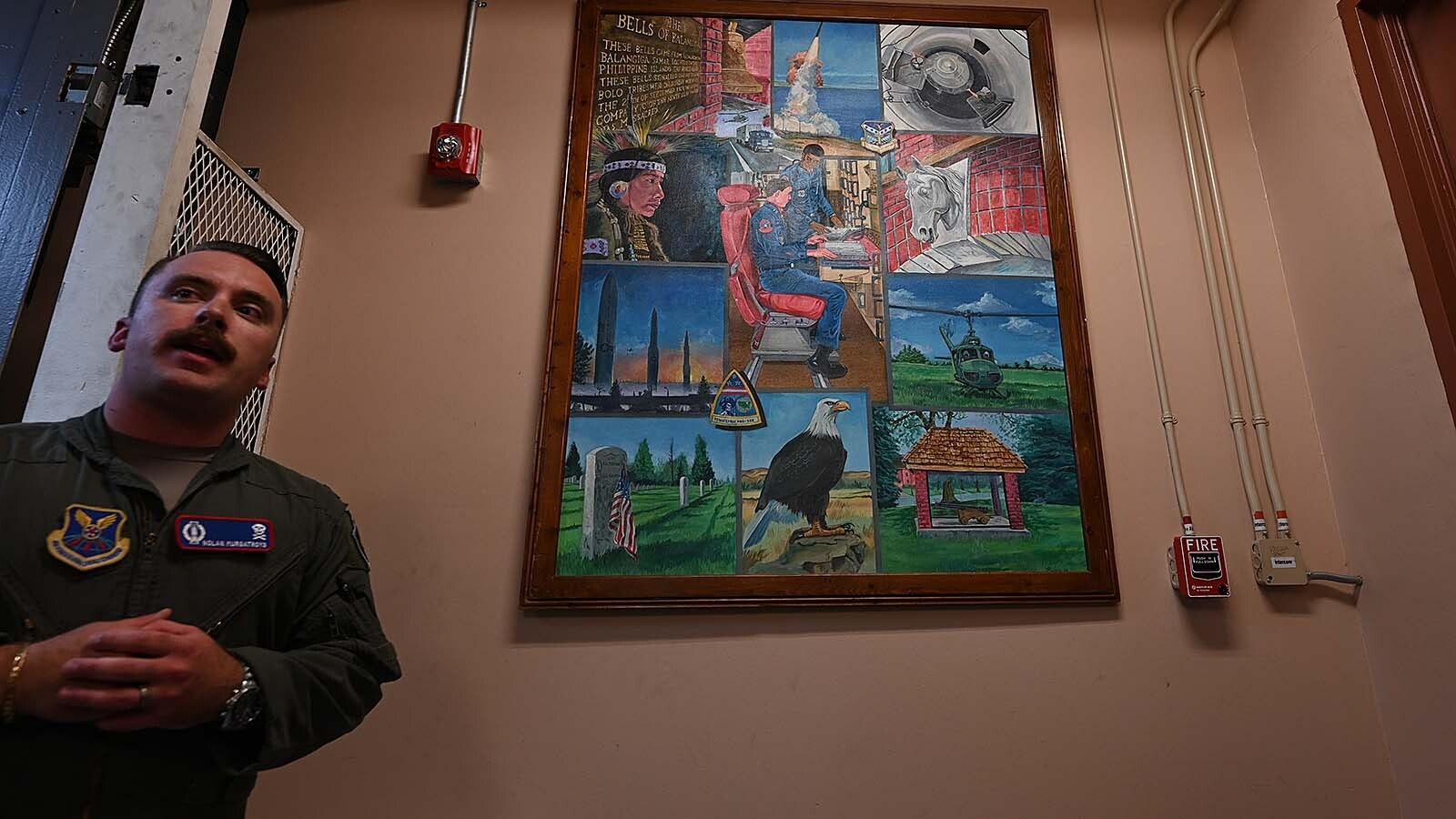 Lt. Nolan Murgatroyd talks about the mural on the wall at Alpha 01 Missile Alert Facility.
