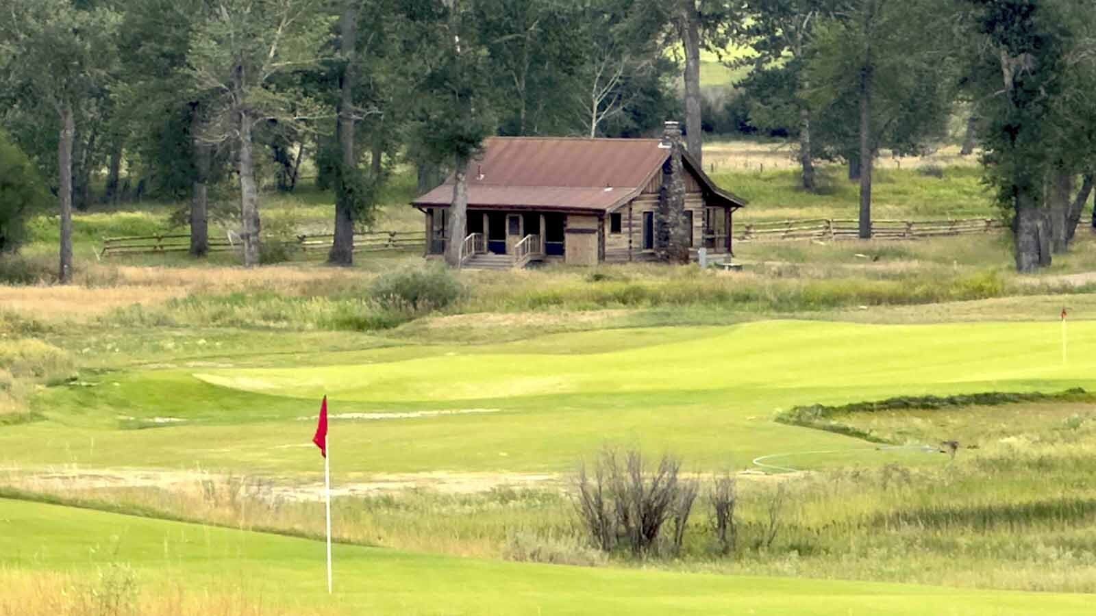 The locals around Twin Bridges call it Charles Kurault’s infamous “Mistress Cabin,” and it’s now just off the fairway at a new golf course on the banks of the Big Hole River.