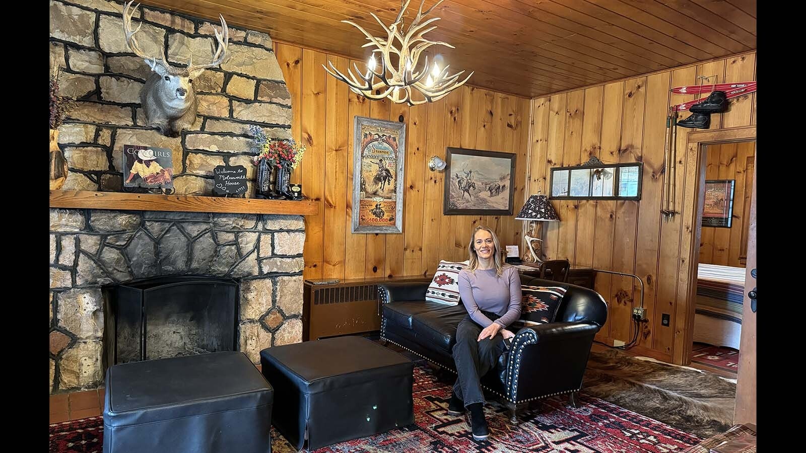Abby Resch of the Cody Lodging Co. sits in the living room of the Molesworth House in Cody. Thomas Molesworth designed and built the house in 1937 with his master craftsman, Paul Hindman. Known for his furniture and other interior creations, the Cody house is the only structure Molesworth designed and built.