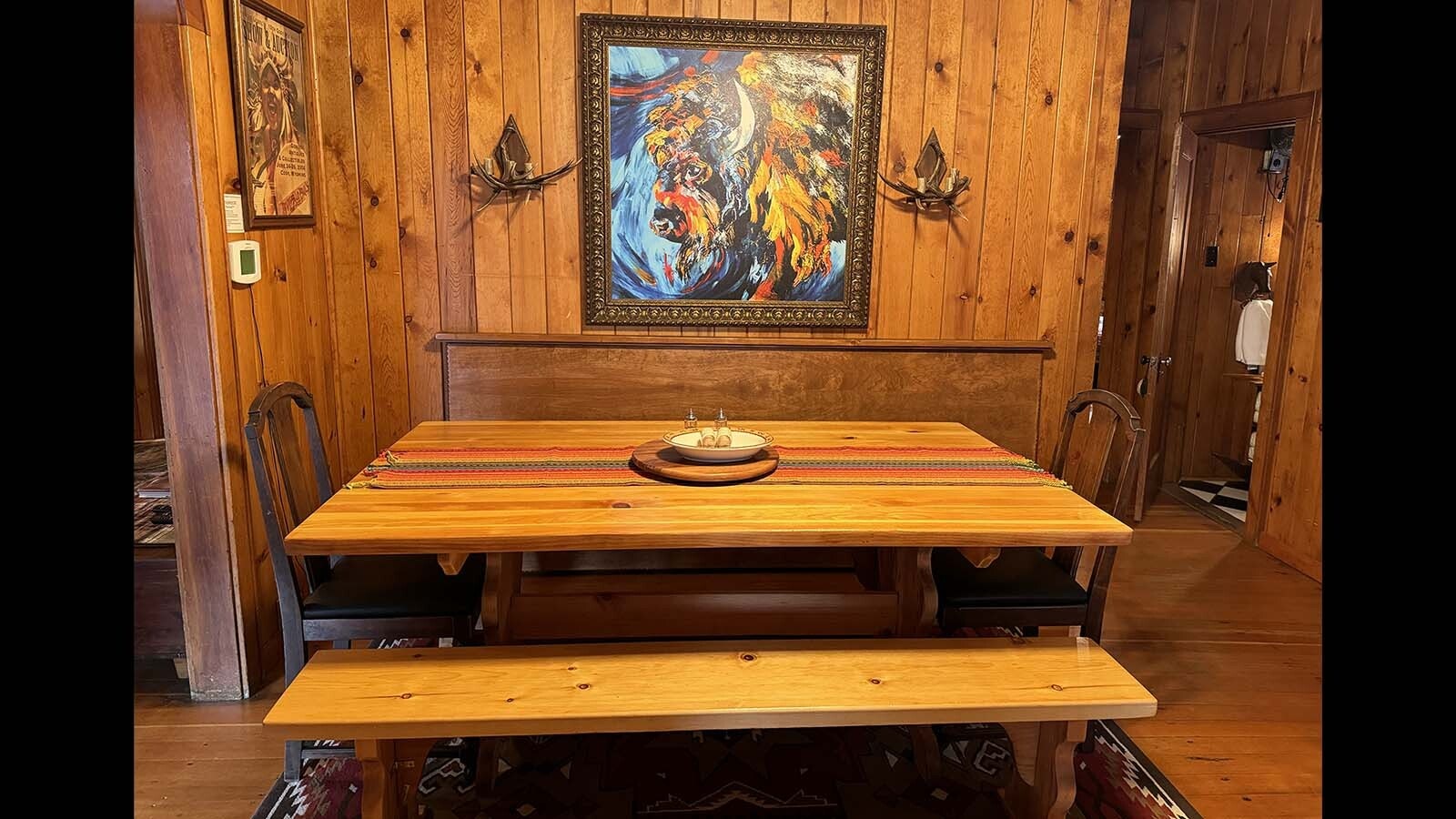A table and wood paneling in the dining area of the Molesworth House in Cody.