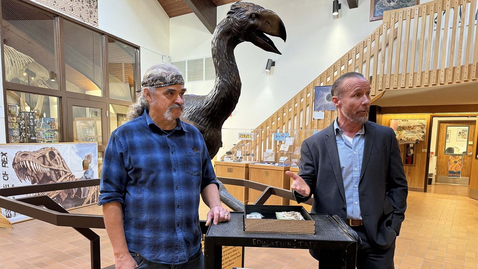 J.P Cavigelli of the Tate Geological Museum at Casper College, left, and Travis Starr of the U.S. Department of Homeland Security at a ceremony donating an Asian Psittacosaurus fossil to the museum.