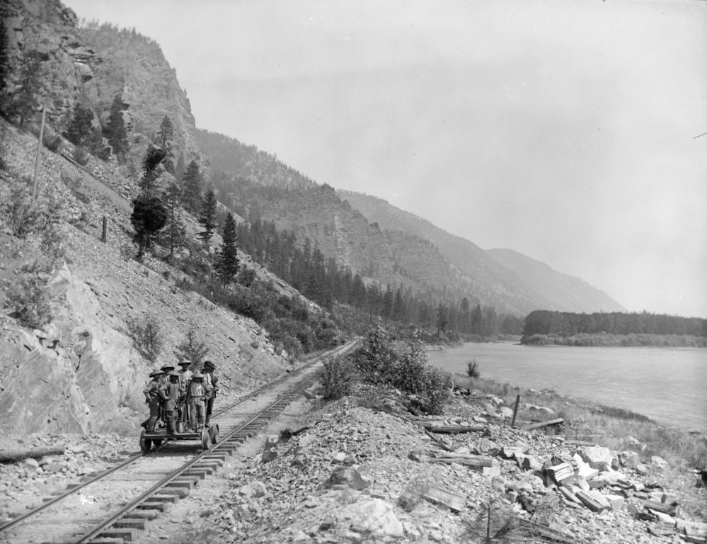 Five Chinese men on a handcar along the Clark's Fork River in Montana in August 1890.