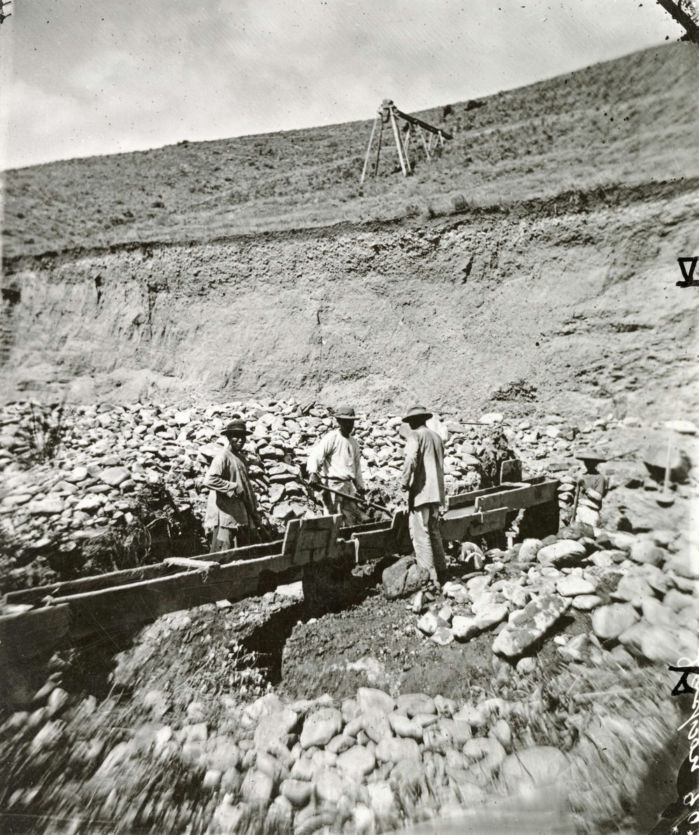 Three possibly Chinese men mining in Alder Gulch, Montana, circa 1871.