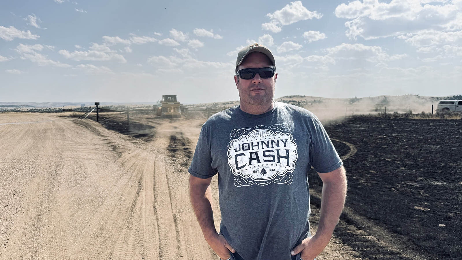 Ryan Bogers, co-owner of the Tongue River Marina in the Tongue River Reservoir State Park in southeastern Montana, stands along the burned area of the Barber Draw Fire that threatened his marina store and other buildings surrounding the reservoir.