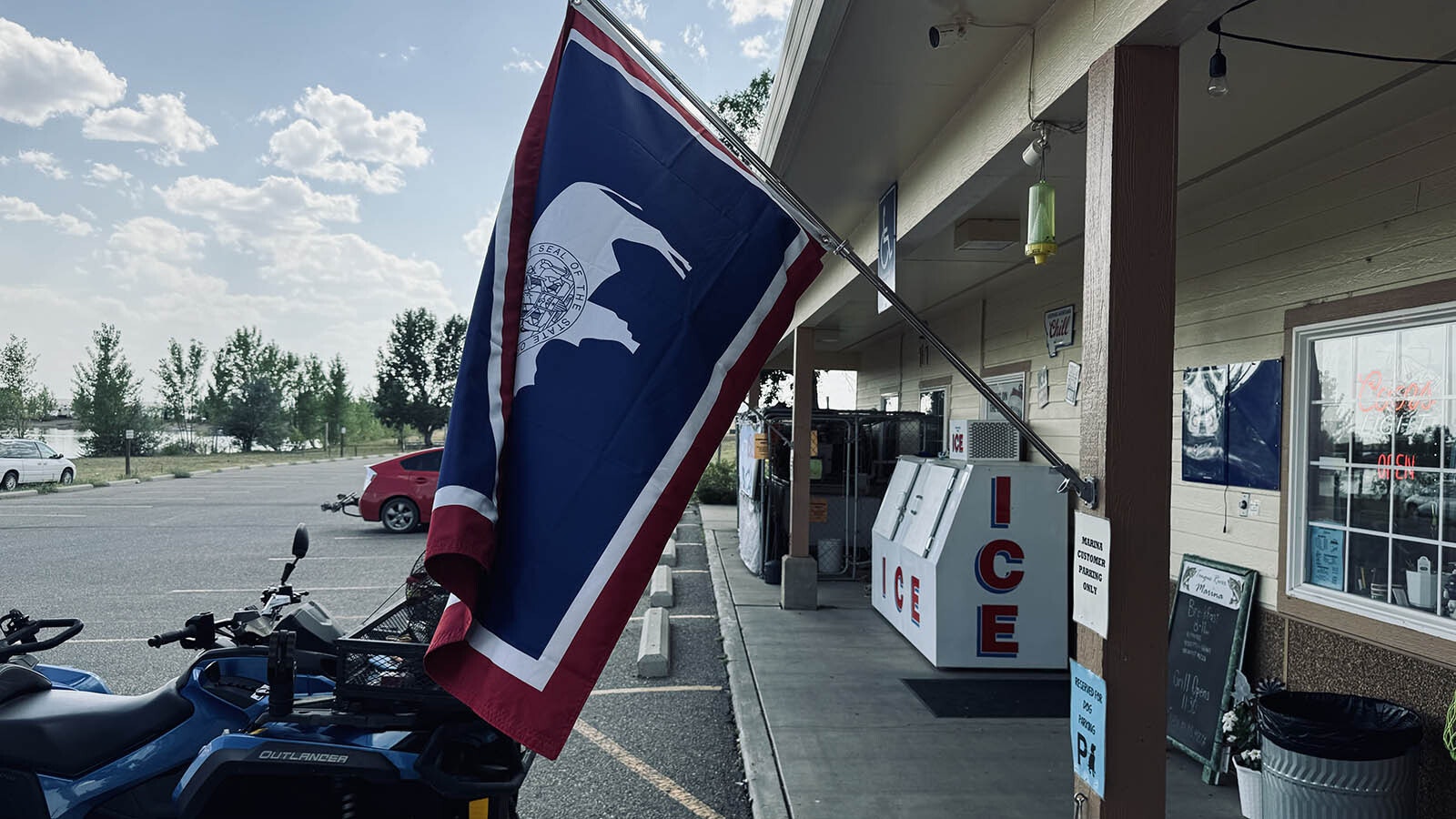 A Wyoming state flag flies in front of the Tongue River Marina store in the Tongue River Reservoir State Park in southeastern Montana.