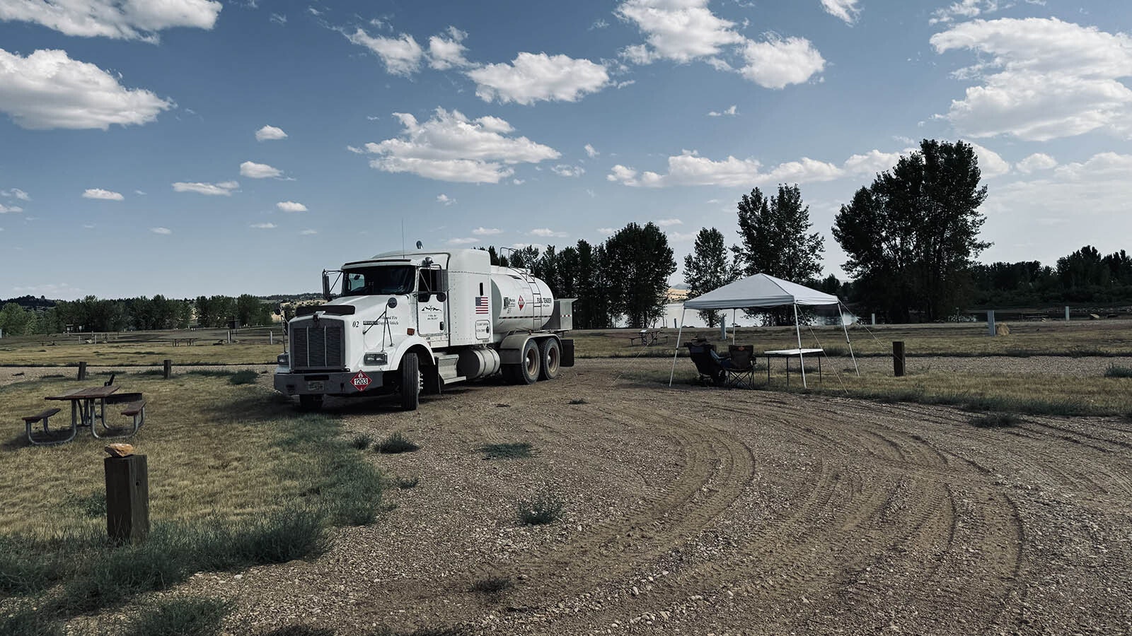 A water tanker parked in the campgrounds of the Tongue River Reservoir State Park, where firefighters are sleeping and eating between shifts in fighting the Remington Fire.