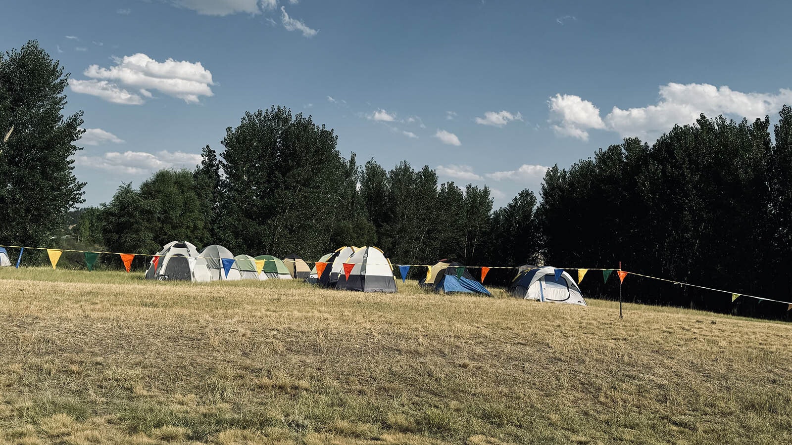 Firefighters working to extinguish the Remington Fire, which has burned more than 130,000 acres from Sheridan to southeastern Montana, are sleeping in tents in the Tongue River Reservoir State Park in Decker, Montana.