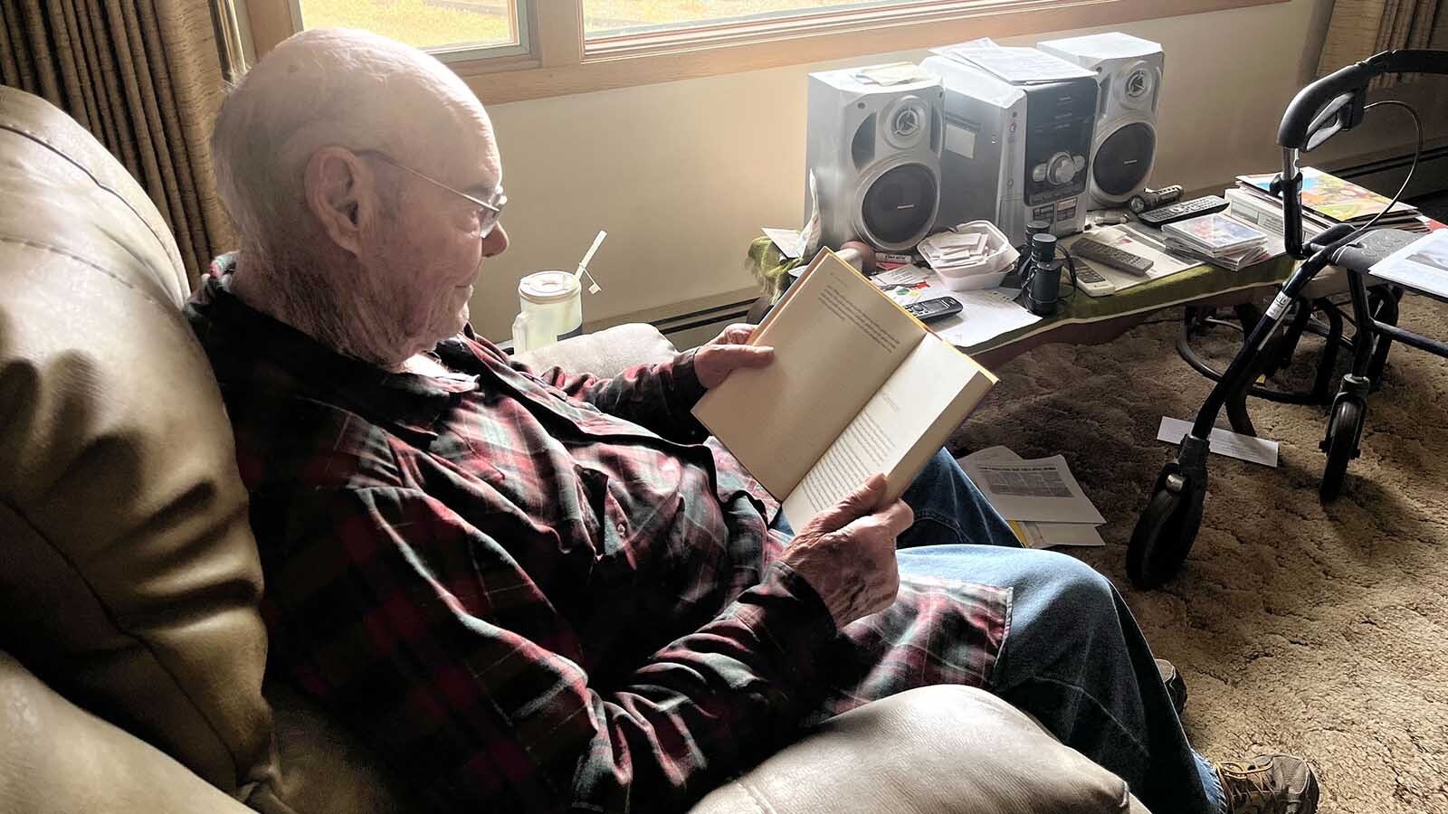 Robert Boettcher reads from his home in Big Sandy.