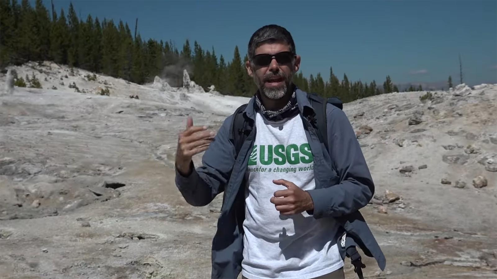 Mike Poland stands in Monument Geyser Basin in Yellowstone National Park to explain how its unique mineral columns were formed.