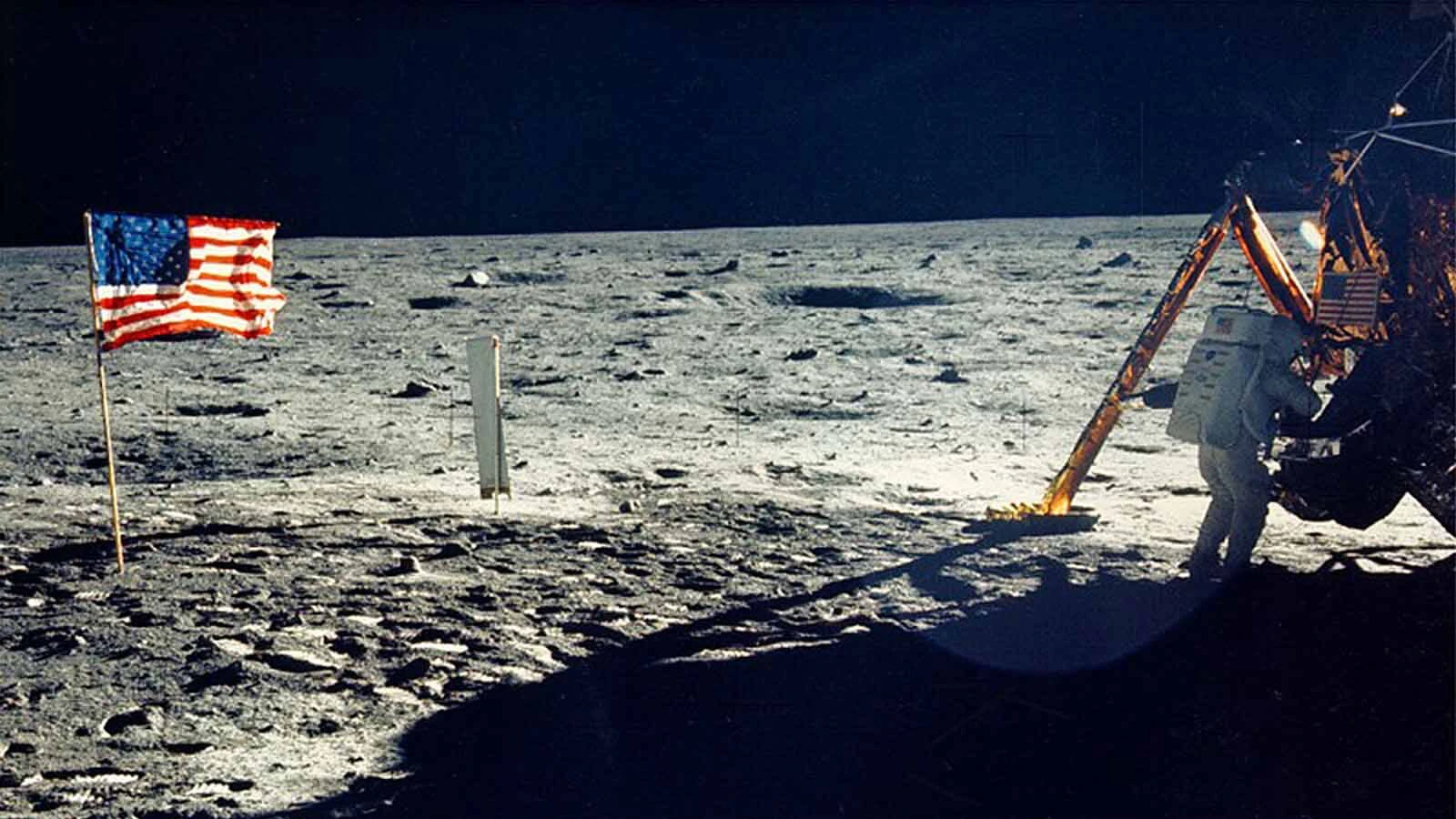 One of the few photographs of Neil Armstrong on the moon shows him working on his space craft on the lunar surface.